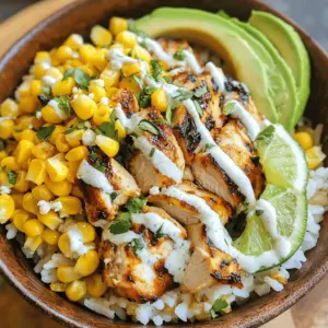 Welcome to your new favorite dish: the Loaded Street Corn Chicken Rice Bowl! This vibrant and flavorful meal combines the classic elements of a beloved Mexican street food, elote (Mexican street corn), with tender chicken and fluffy rice, creating a satisfying and nutritious experience in a single bowl. Originating from the bustling streets of Mexico, where vendors serve grilled corn topped with creamy sauces and spices, this dish brings the essence of street food right to your kitchen. Its combination of textures and flavors is sure to make it a hit with your family or guests.