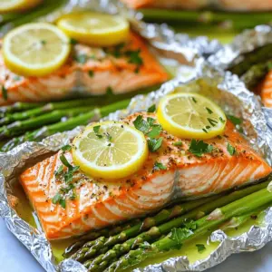 To make a tasty Baked Salmon in Foil with Asparagus, you need a few key ingredients. First, choose good salmon fillets. I like to use fresh, wild-caught salmon when possible. It has a rich flavor that makes for a healthy salmon dinner.