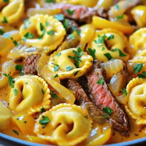 To make this delicious dish, you need a few key ingredients. Start with 12 ounces of cheese tortellini, which you can buy at the store. You also need 8 ounces of ribeye steak, thinly sliced. For the veggies, have one medium onion and a bell pepper, either red or green. You will also want two cloves of garlic, minced. The sauce needs one cup of heavy cream and one cup of shredded provolone cheese. Lastly, grab some Italian seasoning, salt, and pepper to taste, plus fresh parsley for garnish.