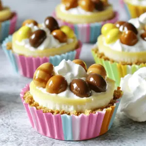 For my No Bake Mini Egg Cheesecakes, I use these simple ingredients: - 1 cup crushed graham crackers - 1/4 cup unsalted butter, melted - 2 cups cream cheese, softened - 1 cup powdered sugar - 1 teaspoon vanilla extract - 1 cup heavy cream - 1/2 cup mini chocolate or caramel eggs (for decoration) - Optional: Whipped cream for serving You can swap graham crackers with digestive biscuits for a different taste. If you don’t have unsalted butter, salted butter works too. For a lighter version, use low-fat cream cheese. You can also replace heavy cream with a non-dairy whipped topping. If you want to cut sugar, use a sugar substitute like stevia or erythritol. Mini eggs can be switched with fruit or nuts for unique flavors. Each ingredient plays a key role in this cheesecake. The graham crackers form a crunchy base. The butter helps hold the crust together. Cream cheese gives the cheesecake its creamy texture and rich flavor. Powdered sugar sweetens the mix and helps it blend smoothly. Vanilla extract adds a lovely aroma. Heavy cream makes the filling light and fluffy. Finally, mini chocolate or caramel eggs make the dessert fun and festive. They also add a sweet bite on top of the rich cheesecake. For the complete recipe, check the [Full Recipe]. To start, gather your ingredients. You will need 1 cup of crushed graham crackers and 1/4 cup of melted butter. Mix them in a medium bowl. Make sure the crumbs are well-coated with butter. This mix will form the base of your cheesecake. Line a muffin tin with cupcake liners. Press about 2 tablespoons of the graham cracker mix into the bottom of each liner. This step is key for a sturdy crust. Set aside the muffin tin while you work on the filling. Now, let’s make the filling. In a large mixing bowl, beat 2 cups of softened cream cheese until smooth. Add 1 cup of powdered sugar and 1 teaspoon of vanilla extract. Mix until everything blends well. In a separate bowl, whip 1 cup of heavy cream until you see soft peaks. This will add lightness to your filling. Gently fold the whipped cream into the cream cheese mixture. Be careful not to deflate the whipped cream too much. This step creates a fluffy texture for your cheesecake. Next, it’s time to assemble. Spoon the cheesecake filling into each cupcake liner over the graham cracker crust. Spread it evenly, filling each liner to the top. Give the tin a light tap on the counter. This helps level out the filling and remove any air bubbles. Place the mini cheesecakes in the fridge for at least 4 hours. They need time to set properly. Once set, carefully remove them from the muffin tin. Peel away the liners gently. Top each mini cheesecake with mini chocolate or caramel eggs for a fun touch. Optionally, serve with a dollop of whipped cream for extra creaminess. For the full recipe, check the earlier section. To make the perfect whipped cream, start with cold heavy cream. Use a clean bowl and beaters. Whip on medium speed until soft peaks form. This takes about 3 to 5 minutes. Don’t over-whip, or it can turn into butter. If you want a sweeter taste, add sugar as you whip. A little vanilla extract adds flavor, too. One common mistake is not using room temperature cream cheese. Cold cream cheese won’t mix well. It can make your filling lumpy. Another mistake is overfilling the cupcake liners. Leave some space for the filling to expand. Finally, don’t skip chilling time. Letting the cheesecakes set is key for the best texture. Garnishing your mini cheesecakes makes them look special. Use mini chocolate or caramel eggs for a fun touch. Fresh fruit like strawberries or raspberries adds color. You can also drizzle chocolate sauce on top. For a fancy touch, add a dollop of whipped cream. This makes the dessert even more inviting. You can find the full recipe here. {{image_2}} You can really have fun with toppings! Try using fresh fruit like strawberries or raspberries. They add a nice pop of color and flavor. You can also use crushed cookies like Oreos for a chocolate twist. If you want something unique, consider adding a drizzle of caramel or chocolate sauce. This makes each bite even more special. You can change the sweetness to fit your taste. If you like it less sweet, reduce the powdered sugar in the filling. You can also swap out the vanilla for almond extract. Almond gives a warm, nutty flavor that many enjoy. Adding lemon juice can brighten the taste, too. Just a teaspoon can make a big difference. These mini cheesecakes work for any event! For birthdays, use colorful sprinkles on top. For holidays, like Easter, stick with pastel-colored eggs. You can even make them for a summer picnic. Just serve them with fresh berries and mint leaves. They are easy to transport and always a hit. Check out the Full Recipe for more ideas on how to customize your mini egg cheesecakes! To keep your mini egg cheesecakes fresh, place them in an airtight container. Store them in the fridge for up to five days. Make sure each cheesecake is covered to prevent drying out. You can freeze these treats too! After they set, wrap each cheesecake in plastic wrap. Place them in a freezer-safe bag or container. They will stay good for up to three months. When you want to eat one, just thaw it in the fridge overnight. To keep the best flavor and texture, avoid refreezing them. Always thaw them gently in the fridge. This way, they stay creamy and delicious. If you plan to freeze them, skip adding toppings until you are ready to serve. This keeps your mini cheesecakes looking fresh and tasty. For the full recipe, check out the previous sections. You can't use real eggs in this no-bake cheesecake. The recipe uses mini chocolate or caramel eggs for decoration only. These candies give a fun touch and sweet flavor. You can also try different kinds of toppings, like fruit or nuts, instead of eggs. These mini cheesecakes stay fresh in the fridge for about five days. Just keep them in an airtight container. After that, they might lose their creamy texture. If you want to enjoy them later, consider freezing them. Yes! You can make this recipe dairy-free. Use dairy-free cream cheese and coconut cream instead of heavy cream. Both will give you a delicious taste and creamy texture. Check labels to ensure other ingredients are dairy-free. We explored the key ingredients needed for tasty mini egg cheesecakes and their roles. I shared step-by-step instructions for making the crust and filling, plus tips for great whipped cream. We also discussed how to avoid mistakes and offered garnishing ideas. For variety, I covered alternative toppings and sweetness adjustments. Lastly, I provided storage tips to keep your treats fresh. Now, you can confidently create these mini cheesecakes for any occasion. Your friends and family will love them!