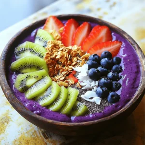- 2 packets of frozen açaí puree - 1 ripe banana - 1 cup of fresh pineapple chunks - 1 cup of coconut milk (or any non-dairy milk) - 1 tablespoon of honey or agave syrup (optional) For a vibrant tropical taste, the main ingredients are key. Açaí puree brings rich color and flavor. It is full of antioxidants. Bananas add creaminess and natural sweetness. Fresh pineapple gives a bright, juicy touch. Coconut milk offers a smooth base. You can use any non-dairy milk you prefer. Honey or agave syrup adds sweetness if needed. - Sliced kiwi - Coconut flakes - Granola - Chia seeds - Fresh berries (e.g., strawberries, blueberries) Toppings make your smoothie bowl pop! Sliced kiwi adds a zesty kick. Coconut flakes give it a tropical crunch. Granola provides texture and flavor. Chia seeds offer extra nutrients. Fresh berries, like strawberries and blueberries, add color and taste. You can mix and match these toppings for a fun look. For the full recipe, please refer to the section above. 1. Blend the ingredients Start by adding the frozen açaí puree, ripe banana, fresh pineapple chunks, and coconut milk into a blender. If you want it sweeter, you can add honey or agave syrup. Blend this mixture on high speed until it becomes creamy and smooth. 2. Adjust consistency with coconut milk If your smoothie is too thick, just add a bit more coconut milk. Blend again until you reach the texture you want. This step is key to making your smoothie bowl enjoyable. 3. Pour into a bowl Once blended, carefully pour the smoothie mixture into a bowl. Make sure to use a large enough bowl to hold all the goodness. 4. Add toppings creatively Now comes the fun part! Arrange your toppings, such as sliced kiwi, coconut flakes, granola, chia seeds, and fresh berries, over the smoothie. Try to create a colorful pattern. I love making a circular design to highlight all the vibrant colors. - Tips for presentation Use a shallow bowl to show off your beautiful toppings. You can also sprinkle some extra coconut flakes around the edge for a nice touch. A colorful presentation makes your smoothie bowl more fun to eat. - Recommended serving utensils Serve your smoothie bowl with a regular spoon. If you want to make it more special, use a wooden spoon or a cute, colorful one. Enjoy your tropical treat right away to keep it fresh and tasty. For the full recipe, refer to the earlier sections. To make a great smoothie bowl, start with ripe fruits. Ripe fruits taste better and add natural sweetness. Look for bananas that are yellow with some brown spots. When it comes to pineapples, choose ones that smell sweet. It ensures they are juicy and fresh. Blending is key to your smoothie bowl. You want a smooth and creamy texture. If your mix is too thick, add more coconut milk. Blend again until you reach the right consistency. A good blend makes your bowl enjoyable and easy to eat. A colorful topping arrangement makes your smoothie bowl pop. Use fresh berries, sliced kiwi, and coconut flakes. Lay them out in a pattern. A circular design looks appealing and fun. To elevate your smoothie bowl's look, use bowls with interesting shapes. Tall bowls or wide, shallow ones can change the game. Garnish with a sprinkle of chia seeds for a fancy touch. This not only looks great but adds a bit of crunch too. {{image_2}} You can change the non-dairy milk for this smoothie. Almond, soy, or oat milk work well. Each milk adds a different taste. Try using seasonal fruits too. Mango, papaya, or berries add a fresh twist. You can mix and match to find your favorite blend. Want more nutrients? Add spinach or kale to your smoothie. They blend well and boost health. You won’t even taste them! For extra energy, stir in nut butter or protein powder. Both will make your smoothie more filling. They add great flavor too! You can also experiment with different combinations to find the best taste for you. To store leftovers, place your smoothie bowl in the fridge. Use a tight container to keep it fresh. Glass or BPA-free plastic works well for storage. I prefer glass because it keeps flavors better. You can freeze smoothie bowls for later. Just pour the mixture into an airtight container. Leave some space at the top, as it will expand when frozen. To defrost, place it in the fridge overnight. If you’re in a rush, you can use the microwave. Just heat it in short bursts to avoid cooking. Enjoy your tropical treat later with ease! For the recipe, check out the Full Recipe. What is açaí and what are its benefits? Açaí is a small, dark purple berry from Brazil. It is full of antioxidants, which help fight free radicals in the body. Açaí is also rich in fiber, promoting good digestion. Plus, it has healthy fats that support heart health. You can enjoy its fruity taste in many dishes. Can I make this smoothie bowl ahead of time? Yes! You can prepare the smoothie mix and store it in the fridge for up to 24 hours. Just remember to keep the toppings separate. This way, your bowl stays fresh and tasty. How can I make this recipe vegan or gluten-free? To make it vegan, use agave syrup instead of honey. For gluten-free, ensure your granola and any other toppings are gluten-free. Most fruits and coconut milk are naturally gluten-free, so you’re all set! Can I substitute açaí with other fruits? Yes, you can! If you can’t find açaí, try using frozen berries like blueberries or strawberries. These fruits will add sweetness and a burst of color to your bowl. What to do if the smoothie is too thick? If your smoothie is too thick, just add a little more coconut milk. Blend again until you reach your desired creaminess. This will make it easier to pour and enjoy. How to fix a smoothie bowl that tastes too bland? If your smoothie bowl lacks flavor, try adding a splash of vanilla extract or a pinch of salt. You can also mix in a bit of honey or agave syrup for sweetness. Adjust the toppings to add more taste and texture. This article covers how to make a delicious açaí smoothie bowl. You learned about the key ingredients, easy steps for preparation, and creative topping ideas. I shared tips to improve taste and presentation, plus fun variations to try. Don’t forget storage techniques to keep your bowl fresh. With all this information, you can enjoy a tasty and nutritious treat anytime. Get creative with your favorites and make this recipe truly yours. Enjoy every bite!