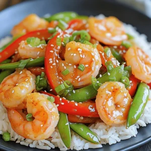 - 1 lb shrimp, peeled and deveined - 2 tablespoons sweet chili sauce - 3 cloves garlic, minced - 1 tablespoon grated ginger - 1 red bell pepper, sliced - 1 cup snap peas - 2 tablespoons soy sauce - 1 tablespoon olive oil - 1 tablespoon sesame oil - 1 tablespoon lime juice - Cooked jasmine rice or quinoa for serving - Chopped green onions and sesame seeds for garnish Gather these ingredients before you start. The shrimp is the star, bringing a sweet and savory flavor. The sweet chili sauce adds a delightful kick. Minced garlic and grated ginger give depth to the dish. A sliced red bell pepper and snap peas add color and crunch. Soy sauce ties all the flavors together. Olive and sesame oils create a rich base. Lime juice adds brightness. Don’t forget the rice or quinoa for serving. Finally, green onions and sesame seeds make for an attractive garnish. This mix of fresh ingredients makes the dish vibrant and tasty. First, grab a medium bowl. Toss 1 pound of peeled and deveined shrimp with 2 tablespoons of sweet chili sauce, 3 cloves of minced garlic, 1 tablespoon of grated ginger, and 1 tablespoon of lime juice. Mix it well. This blend gives the shrimp a great taste. Let it marinate for about 5 to 10 minutes. This time helps the shrimp soak up all the flavor. Next, heat 1 tablespoon of olive oil in a large skillet or wok over medium-high heat. Once the oil is hot, add the marinated shrimp. Cook for about 2 to 3 minutes. You want them to turn pink and opaque. Be careful not to overcook them! Remove the shrimp from the skillet to keep them tender. Set them aside for now. Now, in the same skillet, add 1 tablespoon of sesame oil, 1 sliced red bell pepper, and 1 cup of snap peas. Stir-fry these for about 2 to 3 minutes. You want them to be tender but still crisp. This adds color and crunch to your dish. After that, return the cooked shrimp to the skillet. Pour in 2 tablespoons of soy sauce. Stir everything together for another minute. This helps combine the flavors perfectly. To save time in the kitchen, focus on quick meal prep. Here are a few tips: - Prep ingredients in advance: Chop your vegetables and measure sauces before you start cooking. This makes the process smoother. - Use frozen shrimp: Frozen shrimp are easy to store and ready to use. Just thaw them under cold water for a few minutes before marinating. Choosing the right sweet chili sauce is key. Look for a sauce with natural ingredients and a balanced taste. A good sauce should be sweet but not overly sugary. - Try different brands: Some sauces are thicker and spicier. Find one that fits your taste. - Balance flavors: You can add a splash of soy sauce or lime juice to enhance the dish. This helps bring out the flavors even more. Presentation matters, especially with a colorful dish like this. Here are some tips to make your meal look appealing: - Garnish wisely: Use chopped green onions and sesame seeds for a fresh touch. They add color and crunch. - Serving ideas: Serve your shrimp stir-fry over jasmine rice or quinoa. These sides soak up the sauce and make your plate pop. {{image_2}} You can switch shrimp for other proteins. Chicken works great if you want a meat option. Tofu is an excellent choice for a plant-based meal. Both options are tasty and easy to prepare. For veggies, consider using broccoli or zucchini. These add great flavor and texture, making the dish even more fun. Want some heat? Add fresh chili peppers or dried chili flakes. They can make your stir-fry exciting. You can also change how much sweet chili sauce you use. If you want it spicier, reduce the sauce a bit. This way, you can find the perfect balance of sweet and heat. If you're looking to cut carbs, try cauliflower rice. It’s a smart swap for jasmine rice. It tastes great and keeps the dish light. You can easily make cauliflower rice by grating fresh cauliflower. This keeps your meal flavorful while being healthy. To store your shrimp stir-fry, place it in an airtight container. This keeps moisture in and prevents other odors from mixing in. You can safely store it in the fridge for up to three days. After that, the shrimp may lose its quality and flavor. When reheating, you have two great options: microwave or skillet. If using a microwave, place the stir-fry in a bowl and cover it with a lid. Heat in short bursts, stirring in between. This helps keep the shrimp from getting tough. If you prefer a skillet, add a splash of water and heat over medium. Stir gently to keep the shrimp tender. To freeze shrimp stir-fry, make sure it cools completely first. Then, transfer it to a freezer-safe bag or container. Remove as much air as possible to prevent freezer burn. Properly stored, it can last up to three months. When you’re ready to eat, thaw it overnight in the fridge. To reheat, follow the same steps as above for best results. Cooking shrimp is quick and easy. When you sauté shrimp, it takes about 2-3 minutes. You should cook shrimp until they turn pink and opaque. This ensures they are fully cooked. If you boil or grill shrimp, the time is similar. Always check to make sure they are not overcooked. Overcooked shrimp can become tough. Yes, you can prepare this dish ahead of time. Marinate the shrimp and chop the veggies in advance. Store them in separate airtight containers in the fridge. You can keep the shrimp for up to 24 hours. The veggies are best used within 2 days. When you are ready to eat, just stir-fry everything together. This saves time and makes dinner quick. If you don’t have sweet chili sauce, there are a few tasty alternatives. You can mix honey with sriracha for a sweet and spicy kick. Another option is to use hoisin sauce, but it is thicker and sweeter. You could also try a mix of ketchup and hot sauce. Each option will give you a different flavor but will still be yummy. This dish can be gluten-free, depending on the soy sauce you use. Regular soy sauce contains gluten. Look for gluten-free soy sauce or tamari instead. These options give you the same taste without the gluten. Always check labels to ensure your ingredients meet your dietary needs. Enjoy your meal worry-free! This blog post covered a tasty shrimp stir-fry. We detailed the ingredients, from shrimp and veggies to sauces. You learned how to marinate, cook shrimp, and stir-fry veggies. We shared tips to save time and perfect flavors. For variety, consider alternatives like chicken or tofu. Proper storage and reheating ensure you enjoy leftovers too. With these insights, you can create delicious meals that impress. Enjoy cooking!