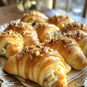 - 1 package (8 oz) crescent roll dough - 1 cup cream cheese, softened - ¼ cup powdered sugar - 1 teaspoon vanilla extract - 1 apple, peeled and finely chopped (Granny Smith or Honeycrisp) - ½ teaspoon ground cinnamon - ¼ cup caramel sauce (plus extra for drizzling) - ¼ cup chopped pecans or walnuts (optional) - 1 egg, beaten (for egg wash) - 1 tablespoon sugar (for topping) I love using fresh ingredients for this recipe. The crescent roll dough is the base. It gives a flaky, buttery taste. The cream cheese adds richness and creaminess. The powdered sugar sweetens the filling just right. Vanilla extract enhances all the flavors. Choosing the right apple is key. I prefer Granny Smith for its tartness, but Honeycrisp works well too. The ground cinnamon adds warmth and spice. Caramel sauce brings a sweet, gooey touch. If you like crunch, add pecans or walnuts. The egg wash helps the rolls turn golden brown. Finally, a sprinkle of sugar on top adds a nice sweetness. These ingredients come together to create a delightful treat that everyone will love. - Preheat your oven to 375°F (190°C). Line a baking sheet with parchment paper. - In a mixing bowl, combine 1 cup of softened cream cheese, ¼ cup of powdered sugar, and 1 teaspoon of vanilla extract. Mix until smooth. - Fold in 1 peeled and finely chopped apple, ½ teaspoon of ground cinnamon, and ¼ cup of caramel sauce into the cream cheese mixture. Add chopped pecans or walnuts if you like. - Unroll the crescent roll dough and separate it into 8 triangles. - Place a generous tablespoon of the cheesecake filling at the wide end of each triangle. - Roll the dough from the wide end to the narrow end, tucking in the filling. - Brush the tops with a beaten egg and sprinkle with 1 tablespoon of sugar for crunch. - Bake for 12-15 minutes or until golden brown. - Let them cool for a few minutes. Drizzle with extra caramel sauce before serving. - To soften cream cheese, leave it out for 30 minutes. You can also microwave it for 10 seconds. - Avoid dough tears by rolling gently and not overstuffing. Ensure the filling is tucked in well. - Choose crisp apples like Granny Smith or Honeycrisp for a sweet and tart taste. - Add spices like nutmeg or allspice for depth. A pinch can make a big difference. - Serve on a nice platter, warm and drizzled with caramel. Add a sprinkle of chopped nuts for style. - Pair with hot cider or coffee for a cozy feel. They also taste great with vanilla ice cream! {{image_2}} You can make this recipe even more fun! Try adding chocolate chips or butterscotch for a sweet twist. They melt beautifully and add rich flavor. You can also mix in dried fruits like raisins or cranberries. Toffee bits give a nice crunch and extra sweetness. These changes let you create a new treat every time! If you need gluten-free options, look for gluten-free crescent dough at the store. Many brands offer tasty choices. For those who want a vegan option, you can use vegan cream cheese. It works well and keeps the creamy texture. These swaps let everyone enjoy this dessert! Seasonal flavors can make this recipe shine. In fall, add pumpkin spice to the filling for a cozy flavor. Just mix in some pumpkin puree and spices. In summer, you can swap apples for berries like blueberries or strawberries. They add freshness and color to your rolls. These variations keep your dessert exciting all year long! To keep your caramel apple cheesecake crescent rolls fresh, place them in the fridge. Use a plate or container that can be covered. They stay good for about 3 days. After that, they may lose their flavor and texture. You can freeze these rolls before or after baking. - To freeze uncooked rolls: Once you shape them, place them on a baking sheet. Freeze them for about 30 minutes. After they are firm, transfer them to an airtight bag. This way, they won’t stick together. - To freeze cooked rolls: Let them cool completely. Wrap them well in plastic wrap, then place them in an airtight container. They can stay frozen for up to 2 months. To thaw, just leave them in the fridge overnight. Reheat cooked rolls in the oven at 350°F (175°C) for about 10 minutes. I recommend using airtight containers for your crescent rolls. Glass or plastic containers work well. If you prefer to wrap them, use plastic wrap tightly. This helps keep them fresh and tasty for longer. Can I use a different fruit instead of apple? Yes, you can use other fruits. Pears or peaches work well. You can also try berries for a fresh twist. Just make sure the fruit is not too watery. How do I know when the rolls are done baking? The rolls are ready when they turn golden brown. You can also check by gently pressing the top. If it feels firm, they are done. Can I make the filling ahead of time? Absolutely! You can mix the filling a day in advance. Store it in the fridge until you are ready to use it. This makes the process quicker and easier. How to scale this recipe for larger gatherings? To scale up, simply double or triple the ingredients. Use more packages of crescent dough. This way, you can make enough rolls for everyone. Just keep an eye on the baking time. What can I substitute for cream cheese? If you need a swap, try mascarpone or ricotta cheese. These will give a similar creamy texture. You can also use a dairy-free cream cheese for a vegan option. What drinks go well with these rolls? These rolls pair nicely with hot apple cider or sweet tea. You can also serve them with coffee for a cozy treat. Can I serve them at room temperature? Yes, you can serve these rolls at room temperature. They still taste great, but warm is best! Just make sure to drizzle the caramel before serving for extra flavor. This blog post covered how to make tasty caramel apple cheesecake crescent rolls. You learned about the main ingredients, preparation steps, and tips for flavor. We discussed variations for dietary needs and fun serving ideas. You also got storage tips to keep your rolls fresh. Remember, these treats are easy and fun to make. You can change them up based on your likes. Enjoy these rolls at your next gathering or as a special dessert!