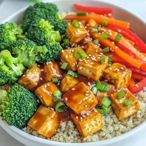 - 14 oz firm tofu, pressed and cubed - 1 cup broccoli florets - 1 red bell pepper, sliced - 2 carrots, julienned - 1 cup cooked quinoa or rice (for serving) - 3 tablespoons soy sauce (low sodium) - 2 tablespoons hoisin sauce - 1 tablespoon rice vinegar - 1 tablespoon sesame oil - 2 cloves garlic, minced - 1 teaspoon ginger, minced - 1 green onion, chopped (for garnish) - Sesame seeds (for garnish) - Salt and pepper to taste The main ingredients in my General Tso's Tofu Bowls bring life and color to the dish. Firm tofu provides a hearty base, while broccoli, bell pepper, and carrots add crunch and nutrition. You can serve this dish over cooked quinoa or rice, giving it a nice, filling touch. For the sauce, I mix soy sauce, hoisin sauce, and rice vinegar. These flavors come together with garlic and ginger, creating a rich taste. The sesame oil adds a nutty finish that elevates the dish. I finish each bowl with green onion and sesame seeds. These ingredients not only look great but also add a bit of flavor. A sprinkle of salt and pepper rounds everything out. Each ingredient plays a role in making this dish both tasty and satisfying. First, you need to press the tofu. This helps remove water and makes it crispy. Press it for at least 15 minutes. After pressing, cut the tofu into small cubes. Season the cubes with salt and cornstarch. Toss them gently to coat. Next, heat some vegetable oil in a large skillet over medium-high heat. Once hot, carefully add the tofu cubes. Fry them for about 8-10 minutes. You want them golden brown and crispy. When done, place the tofu on a plate lined with paper towels. This helps absorb any extra oil. In the same skillet, it’s time to add the veggies. Toss in the broccoli florets, sliced red bell pepper, and julienned carrots. Stir-fry these for about 3-4 minutes. You want them tender but still bright and crunchy. Let’s make the sauce! In a small bowl, mix 3 tablespoons of soy sauce, 2 tablespoons of hoisin sauce, 1 tablespoon of rice vinegar, and 1 tablespoon of sesame oil. Add 2 cloves of minced garlic and 1 teaspoon of minced ginger. Stir well until everything is combined. Now, add the crispy tofu back to the skillet with the veggies. Pour the sauce mixture over the tofu and vegetables. Stir well to coat everything. Cook for an additional 2-3 minutes. This helps heat the dish and thicken the sauce a bit. To serve, divide cooked quinoa or rice among bowls. Top each bowl with the tofu and vegetable mixture. For a nice touch, garnish with chopped green onions and a sprinkle of sesame seeds. Enjoy your General Tso's Tofu Bowls! To make crispy tofu, follow these steps: - Press tofu for at least 15 minutes. This removes excess moisture. - Cut tofu into bite-sized cubes. This helps them cook evenly. - Season the cubes with salt and coat them in cornstarch. This gives a nice crunch. For pressing, use a tofu press or a heavy pan. Place the tofu between paper towels and set the weight on top. This method works well to remove moisture quickly. You can swap vegetables based on what you have. Try: - Snap peas instead of broccoli. - Zucchini or mushrooms for bell peppers. - Sweet potatoes or green beans for carrots. Seasonal vegetables add freshness. Use asparagus in spring or squash in fall for great flavor. Pair your bowls with sides like: - Steamed edamame for protein. - A crispy salad for crunch. - Green tea or ginger ale for drinks. To enhance your dish, drizzle extra sesame oil on top. A sprinkle of chili flakes adds heat. Arrange the tofu and veggies nicely for a colorful plate. {{image_2}} You can make General Tso's Tofu Bowls even better with vegan twists. Try adding more plant-based proteins. Chickpeas or lentils can boost the protein. These options add a different texture and taste. You can also replace sauces. Instead of soy sauce, use tamari for a gluten-free option. Coconut aminos is another great substitute. It has a sweet, mild taste. This change can suit different dietary needs. Making this dish gluten-free is easy. For soy sauce, pick a gluten-free brand. Tamari works well and tastes similar. You can also look for gluten-free hoisin sauce. This way, you keep the flavor without gluten. Other ingredients can also be swapped. Use gluten-free cornstarch for thickening. Ensure all packaged items are gluten-free. This keeps your meal safe for those with gluten sensitivities. Adjusting the spice level is simple. Want it sweeter? Add a touch more hoisin sauce. If you like heat, add chili flakes or sriracha. You can mix these into the sauce for a kick. To add flavor depth, try adding more garlic or ginger. These ingredients bring warmth and aroma. You can also experiment with different peppers for a unique taste. Each choice can change the dish's flavor profile. To store leftovers, let the dish cool down first. Place it in an airtight container. You can keep it in the fridge for up to three days. This keeps the flavors fresh and safe to eat. You can freeze the tofu and sauce separately. Wrap the tofu in plastic wrap, then place it in a freezer bag. For the sauce, pour it into a container and seal it tight. When you want to eat it, thaw overnight in the fridge. Reheat the tofu on a skillet over medium heat for a crispy texture. For meal prep, chop all veggies ahead of time. Store them in separate containers to keep them fresh. You can also cook the quinoa or rice in advance. This way, you just need to heat everything up when you're ready to eat. Having the ingredients prepped makes meal time quick and easy. To make General Tso's tofu gluten-free, use gluten-free soy sauce. Look for brands that are labeled gluten-free. You can also find gluten-free hoisin sauce. Check the labels to ensure they do not contain wheat. This simple swap makes the dish safe for those with gluten sensitivities. Yes, you can use different vegetables in this dish. Feel free to swap broccoli with snap peas or bok choy. You can also replace bell peppers with zucchini or mushrooms. Just remember to keep the cooking times in mind. Aim for vibrant colors and textures. Serve General Tso's tofu with cooked quinoa or rice. These are great bases for the dish. You can also add a side of steamed green beans or a fresh salad. For drinks, try serving it with green tea or a light lager. These pair well with the flavors. To make General Tso's sauce, mix together soy sauce, hoisin sauce, rice vinegar, and sesame oil. Add minced garlic and ginger for extra flavor. Adjust the sweetness by adding a bit of sugar or honey. Stir until combined, and it’s ready to use! General Tso's tofu is a healthy option. Tofu is a great source of protein and is low in calories. The vegetables add vitamins and minerals. Using quinoa instead of rice boosts fiber too. Overall, this dish offers a balanced meal with plenty of nutrients. In this blog post, we explored how to make a delicious General Tso's tofu dish. You learned about the key ingredients, such as tofu, fresh veggies, and sauces. I shared step-by-step instructions to perfectly prepare and serve your meal. Lastly, we discussed tips for variations, storage, and answered common questions. By following these steps, you can create a tasty, healthy meal at home. Enjoy this flavorful dish and feel proud of your cooking skills!