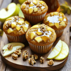 - 2 cups all-purpose flour - 1 cup granulated sugar - 1 tablespoon baking powder - ½ teaspoon salt - 1 teaspoon ground cinnamon - ½ teaspoon nutmeg - ½ cup unsalted butter, melted - 1 cup milk - 2 large eggs - 1 teaspoon vanilla extract - 2 cups diced apples (peeled, such as Granny Smith or Honeycrisp) - ¼ cup maple syrup (for glaze) - ½ cup powdered sugar (for glaze) These ingredients create a muffin that is soft and flavorful. The apples add a nice texture, while the spices give warmth. Use fresh apples for the best taste. The melted butter keeps the muffins moist. - Chopped walnuts or pecans - Extra maple syrup for drizzling If you want a little crunch, add some nuts on top. They add flavor and texture. You can also drizzle more syrup if you love that sweet taste. Each muffin has about 200 calories. They have 4 grams of protein and 8 grams of fat. The apples add vitamins and fiber. This treat is not just tasty, but also offers some nutrients. Enjoy these muffins as a fun snack or breakfast! Start by preheating your oven to 375°F (190°C). This helps the muffins rise well. Next, grab a large mixing bowl. Add 2 cups of all-purpose flour, 1 cup of granulated sugar, 1 tablespoon of baking powder, and ½ teaspoon of salt. Now, add in 1 teaspoon of ground cinnamon and ½ teaspoon of nutmeg. Whisk these dry ingredients well. Make sure there are no lumps. This mix creates a great base for your muffins. In another bowl, melt ½ cup of unsalted butter. Then, mix in 1 cup of milk, 2 large eggs, and 1 teaspoon of vanilla extract. Stir these wet ingredients until they blend smoothly. This step is key for a rich flavor. The melted butter adds moisture, making your muffins soft and tasty. Pour the wet mix into the bowl of dry ingredients. Stir carefully until just combined. It’s okay if some flour shows. Overmixing can make muffins tough. Now, gently fold in 2 cups of diced apples. Use apples like Granny Smith or Honeycrisp for sweetness. Once mixed, divide the batter evenly into muffin cups. Fill each cup about ⅔ full. This allows space for rising. Place the muffin tin in your preheated oven. Bake for 18 to 22 minutes. Check with a toothpick. If it comes out clean, they’re done. Let the muffins cool in the pan for five minutes. Then, move them to a wire rack. While they cool, prepare the glaze. In a small bowl, whisk together ¼ cup of maple syrup and ½ cup of powdered sugar. Adjust if needed. Drizzle the glaze over cooled muffins. Top with nuts if you like. Enjoy your fresh and flavorful muffins! To keep muffins light, mix carefully. After you add wet ingredients to dry, stir just until you see no dry flour. Lumps are okay! Overmixing makes muffins tough. It’s better to be gentle. This helps the muffins rise and stay soft. Choose apples that add flavor and moisture. I love using Granny Smith or Honeycrisp apples. They balance sweetness and tartness. Other good options include Fuji or Gala. They also hold their shape well during baking. For a great glaze, mix maple syrup and powdered sugar. Start with ¼ cup of syrup and ½ cup of sugar. Whisk until smooth. If it’s too thick, add more syrup. If it’s too runny, add more sugar. You want it thick but pourable. This glaze adds a sweet touch to your muffins. {{image_2}} You can make your muffins special by adding fruits or nuts. For a fruity twist, try mixing in 1 cup of blueberries, cranberries, or even diced pears. These fruits add color and enhance the flavor. If you enjoy nuts, consider adding ½ cup of chopped walnuts or pecans. They bring a nice crunch and a rich taste. Just fold these extras gently into the batter before baking. If you need gluten-free muffins, swap out regular flour for gluten-free flour. Look for a blend made for baking. Make sure it has a good mix of flours and starches. You might need to add a bit more liquid. Start with an extra tablespoon of milk. This small change helps keep the muffins moist and fluffy. For a vegan version, replace the eggs with flax eggs. Mix one tablespoon of ground flaxseed with three tablespoons of water. Let it sit for a few minutes until it thickens. Use almond milk or oat milk instead of regular milk. Instead of butter, use coconut oil or a plant-based butter. These swaps keep your muffins delicious while making them vegan-friendly. To keep your maple glazed apple muffins fresh, store them in an airtight container. Place the muffins in a single layer, if possible. You can also use plastic wrap for extra protection. Keep them at room temperature for up to three days. If you want them to last longer, refrigerate them. This will keep them fresh for up to a week. Freezing is a great option for these muffins. To freeze, let the muffins cool completely. Wrap each muffin in plastic wrap or foil. Then, place them in a freezer-safe bag or container. Label the bag with the date. You can freeze them for up to three months. When you’re ready to enjoy one, just thaw it at room temperature. Reheating is easy! If you want a warm muffin, preheat your oven to 350°F (175°C). Place the muffin on a baking sheet and heat for about 5-10 minutes. You can also use a microwave. Heat the muffin for about 10-15 seconds. This helps bring back that fresh taste and soft texture. Enjoy your muffins warm! Yes, you can swap some ingredients. For flour, try whole wheat flour for a healthier option. You can use brown sugar instead of granulated sugar for extra flavor. If you don’t have apples, pears work well too. You can also replace eggs with applesauce or mashed bananas for a vegan option. Just remember, each swap may change the taste slightly. These muffins stay fresh for about three days at room temperature. Place them in an airtight container to keep them moist. If you want to store them longer, put them in the fridge, where they can last up to a week. For the best taste, warm them slightly before serving. Serve the muffins warm or at room temperature. Drizzle the maple glaze on top right before serving. You can add sliced apples or extra nuts for a nice touch. Pair them with a cup of coffee or tea for a delicious treat. These muffins also make a great breakfast or snack for any time of day. You learned how to make maple glazed apple muffins, from key ingredients to baking. I shared tips to avoid overmixing and to pick the best apples. You can also explore fun variations like gluten-free or vegan options. Proper storage helps keep your muffins fresh for longer. These muffins are tasty and flexible for many diets. Enjoy sharing them and let your creativity shine in the kitchen!