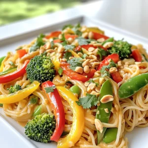 For this spicy peanut veggie noodles recipe, you will need: - 8 oz rice noodles - 1 cup bell peppers (red and yellow), sliced - 1 cup snap peas, trimmed - 1 medium carrot, julienned - 1 cup broccoli florets - 2 green onions, chopped - 1/4 cup cilantro, chopped - 1/3 cup creamy peanut butter - 3 tablespoons soy sauce - 2 tablespoons lime juice - 1 tablespoon sriracha (adjust to taste) - 1 tablespoon sesame oil - 2 cloves garlic, minced - 1 teaspoon fresh ginger, grated - Salt and pepper to taste - Crushed peanuts for garnish You can enhance the dish with these extra ingredients: - Chopped scallions for more flavor - Sesame seeds for a crunchy topping - More veggies like zucchini or mushrooms Each serving of spicy peanut veggie noodles contains: - Calories: 400 - Protein: 12g - Carbs: 60g - Fat: 16g - Fiber: 4g This dish offers a good mix of veggies and protein. Plus, it's tasty and filling! First, cook the rice noodles. Follow the package instructions closely. Usually, this takes about 4 to 6 minutes. Drain the noodles and set them aside. Toss them with some sesame oil. This prevents sticking and adds flavor. Next, let’s prepare the veggies. Slice one cup of red and yellow bell peppers. Trim one cup of snap peas. Julien the medium carrot. Cut it into thin strips. Break one cup of broccoli into small florets. Chop two green onions and a quarter cup of cilantro. Set all these vegetables aside for later. Now, we will make the sauce. In a medium bowl, add one-third cup of creamy peanut butter. Pour in three tablespoons of soy sauce and two tablespoons of lime juice. Add one tablespoon of sriracha for heat. If you like it spicier, add more sriracha. Finally, add two minced garlic cloves and one teaspoon of grated ginger. Whisk everything together until it is smooth. It’s time to combine everything. Heat some sesame oil in a large skillet or wok over medium-high heat. Add the minced garlic and ginger. Sauté for about 30 seconds until fragrant. Then, toss in the bell peppers, snap peas, carrots, and broccoli. Stir-fry for about 5 to 7 minutes. The veggies should be tender yet crisp. Now, add the cooked rice noodles to the skillet. Pour the spicy peanut sauce over the noodles. Gently toss everything together until coated. Finally, mix in the chopped green onions and cilantro. Add salt and pepper to taste. Serve the noodles warm, garnished with crushed peanuts and more cilantro if you want. Enjoy your meal! To cook the rice noodles well, follow the package instructions carefully. Use plenty of water. Bring it to a boil before adding the noodles. Stir them gently to prevent sticking. Cook until they are firm but tender. Drain them and rinse with cold water to stop cooking. Toss with a bit of sesame oil to keep them from clumping together. If you like heat, add more sriracha. Start with one tablespoon, then taste the sauce. Mix well before adding more. You can also add red pepper flakes for extra kick. If it gets too spicy, balance it with more peanut butter or lime juice. For a richer taste, try adding sesame seeds or crushed peanuts. They add crunch and extra flavor. You can also mix in proteins like tofu or chicken for heartiness. Fresh herbs like basil or mint can brighten the dish. Experiment with your favorite vegetables for variety. {{image_2}} You can boost your Spicy Peanut Veggie Noodles with protein. Tofu works great for a plant-based option. Use firm or extra-firm tofu. Press it to remove water, then cut it into cubes. Sauté the tofu until golden and crispy before adding it to the noodles. If you prefer meat, chicken is an excellent choice. Cook bite-sized pieces of chicken in the skillet until they’re fully cooked. Then, mix them in with the noodles and veggies. To make this dish gluten-free, swap the soy sauce for tamari. Tamari is a gluten-free soy sauce that gives great flavor. You can also use gluten-free rice noodles or quinoa noodles. Both options will work well and keep the dish tasty. Just make sure to check the package for cooking times, as they may differ. Making this dish vegan is simple. The recipe is nearly vegan already! Just ensure you choose vegan soy sauce and peanut butter. Most brands are vegan, but it’s always good to check. If you want to add more veggies, consider mushrooms or zucchini for extra flavor. These additions will keep the dish fresh and vibrant. After you enjoy your Spicy Peanut Veggie Noodles, you may have some left. Store the leftovers in an airtight container. Keep them in the fridge. They will stay fresh for about 3 to 4 days. Make sure to cool the noodles to room temperature before sealing them. This helps prevent sogginess. Reheating is easy! You can use a microwave or a stove. If using a microwave, place the noodles in a bowl. Add a splash of water to keep them moist. Heat in short bursts, stirring in between. On the stove, heat a skillet over low heat. Add the noodles and a bit of water. Stir until warmed through. This way, they stay tasty and do not dry out. You can freeze Spicy Peanut Veggie Noodles too! Place them in a freezer-safe container. Make sure to leave space for expansion. They can last up to 2 months in the freezer. When ready to eat, thaw them overnight in the fridge. Reheat them as mentioned above. Freezing keeps the flavors intact, so enjoy them later! To make Spicy Peanut Veggie Noodles vegan, simply substitute soy sauce with a vegan brand. Check the label for any animal products. Use rice noodles as they are usually vegan. The creamy peanut butter is often vegan, but double-check the ingredients. You can also add more veggies or tofu for protein. If you can't find rice noodles, try using whole wheat noodles or soba noodles. Both options work well with the spicy peanut sauce. You can also use zucchini noodles for a low-carb choice. Just remember to cook them lightly to keep them fresh and crunchy. Yes! You can prep the veggies and sauce a day in advance. Store the veggies in the fridge in an airtight container. Keep the peanut sauce separate to maintain the flavor. When ready to eat, just cook the noodles and combine everything. This saves time on busy days. Spicy Peanut Veggie Noodles pair well with a simple green salad. A cucumber salad with rice vinegar adds a nice crunch. You can also serve spring rolls for a fresh bite. Any of these sides will enhance your meal and add variety. In this post, you learned how to make tasty Spicy Peanut Veggie Noodles. We covered the key ingredients, step-by-step cooking, and helpful tips. You can adjust spice levels and add proteins like tofu or chicken. Storing leftovers is easy, and reheating is simple. For more flavor, try different veggies. Now it’s your turn to create your dish! Enjoy the fun of making and sharing this meal with friends.