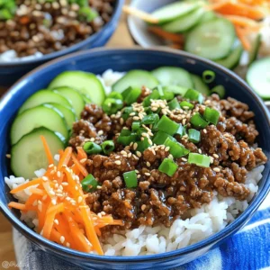 To make Korean beef bulgogi bowls, you need these key ingredients: - 1 lb (450g) lean ground beef - 1 medium onion, thinly sliced - 3 cloves garlic, minced - 1 inch piece of ginger, minced - 3 tablespoons soy sauce - 2 tablespoons brown sugar - 1 tablespoon sesame oil - 1 tablespoon gochujang (Korean chili paste) - 1 teaspoon black pepper - 2 green onions, chopped - 2 cups cooked jasmine rice - 1 cup shredded carrots - 1 cup cucumber, thinly sliced - Sesame seeds for garnish These ingredients bring rich flavors together. The ground beef cooks quickly, making this dish perfect for busy nights. The soy sauce and gochujang add that special Korean kick. You can personalize your bowls with these extras: - Kimchi for a spicy crunch - Sliced radishes for a fresh bite - Avocado for creaminess - Extra sesame oil for added depth These toppings not only enhance the taste but also add color to your dish. Feel free to mix and match! If you need to swap ingredients, here are some ideas: - Use turkey or chicken for a leaner protein. - Substitute tamari for a gluten-free option. - Honey or maple syrup can replace brown sugar. - Try zucchini noodles instead of rice for a low-carb option. These substitutions can help you adjust the recipe based on what you have. Don’t be afraid to get creative! Start by heating a large skillet over medium-high heat. Add 1 pound of lean ground beef. Cook the beef until it is browned, which takes about 5 minutes. Use a spatula to break it apart as it cooks. If there’s too much grease, drain some off. This step keeps your dish light and tasty. Next, add a medium onion, thinly sliced, to the skillet. Then, toss in 3 cloves of minced garlic and 1 inch piece of minced ginger. Sauté these for about 3 to 4 minutes. You want the onions to turn translucent. This step brings out the rich flavors in your dish. Now it's time to build your bowls. Place about ½ cup of cooked jasmine rice at the bottom of each serving bowl. Top the rice with your bulgogi beef mixture. Add shredded carrots and thinly sliced cucumber on top of the beef. Finally, sprinkle chopped green onions and sesame seeds to enhance flavor and crunch. Serve your bowls warm for the best taste. To make the best bulgogi, choose lean ground beef. This keeps your dish light. Cook the beef in a hot skillet to get a nice sear. Break it apart as it cooks. This helps it brown evenly. Drain any extra fat to keep it healthy. Add the onions, garlic, and ginger only after the beef is browned. This keeps the flavors fresh. Let everything cook together for a few minutes. This melds the tastes beautifully. For a true Korean feel, build your bowls right. Start with jasmine rice at the bottom. This rice is soft and fragrant. Layer the bulgogi beef on top. Next, add shredded carrots and cucumber slices. These add crunch and color. Finish with green onions and sesame seeds. Don't forget to serve with kimchi. This fermented dish gives a spicy kick. A drizzle of sesame oil adds a rich flavor. Want to make your bulgogi even better? Try adding more spices. A pinch of red chili flakes can add heat. You can also use fresh herbs like cilantro for brightness. For a sweet touch, add sliced pears or apples. These fruits balance the savory beef. If you love crunch, sprinkle some crushed peanuts on top. This gives a nice texture contrast. Enjoy experimenting with flavors! {{image_2}} You can easily make this dish vegetarian or vegan. Simply swap the ground beef for firm tofu or tempeh. Both options soak up flavors well. Use the same marinade to infuse taste. Just crumble or cube the tofu, then cook as you would the beef. This change keeps the dish both tasty and meat-free. If you want to switch proteins, you have options. You can use ground turkey, chicken, or even pork. Each will create a unique flavor. Just adjust cooking times slightly. For beef, aim for a lean cut to keep it healthy. The same goes for chicken; use lean thighs or breasts. To add heat, increase the gochujang amount. You can also add sliced jalapeños. If you prefer a milder dish, reduce the gochujang. For an extra kick, try adding crushed red pepper flakes. This lets you control the heat level based on your taste. You can store leftovers in an airtight container. Let the beef cool before sealing. Keep it in the fridge for up to three days. This keeps the flavors fresh and safe to eat. To reheat, use a skillet over medium heat. Add a splash of water or broth to keep it moist. Stir until heated through, about five minutes. You can also use the microwave. Heat in short bursts for one to two minutes. Stir in between to ensure even heating. If you want to freeze, portion the beef into freezer-safe bags. Press out the air before sealing. It keeps well for up to three months. Thaw it overnight in the fridge when ready to eat. Reheat as mentioned above for a quick meal. Bulgogi is a popular Korean dish made with marinated beef. The name means "fire meat." It uses thin slices of beef cooked quickly over high heat. For my Minute Korean Beef Bulgogi Bowls, I use lean ground beef for ease and speed. The marinade includes soy sauce, brown sugar, ginger, and garlic, giving it a sweet and savory flavor. You can enjoy bulgogi in many forms, such as in rice bowls or wrapped in lettuce. Yes, you can make bulgogi ahead of time. Cook the beef and let it cool. Store it in an airtight container in the fridge for up to three days. When you're ready to eat, just reheat it on the stove. This method saves time for a busy weeknight meal. You can also freeze the cooked bulgogi for longer storage. Just make sure to defrost it in the fridge before reheating. You can serve your Korean Beef Bulgogi Bowls with various tasty sides. Here are some ideas: - Kimchi: This spicy fermented cabbage adds a tangy crunch. - Pickled vegetables: Quick-pickled radishes or cucumbers bring freshness. - Steamed broccoli: This adds color and nutrients to your meal. - Sesame oil drizzle: A little extra oil enhances the flavors. These sides make your meal more exciting and complete. Enjoy your delicious bowls! Korean Beef Bulgogi bowls are easy to make and delicious. You learned about essential ingredients, cooking steps, and tips for great flavor. We discussed variations and how to store leftovers, ensuring you can enjoy these bowls anytime. Try different proteins or spice levels to match your taste. With a bit of practice, you will master this dish, impressing friends and family alike. Enjoy your cooking adventure!
