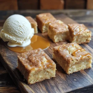 Snickerdoodle blondies are a soft, chewy treat. They mix the rich taste of brown sugar with warm cinnamon. The blondies have a sweet, buttery flavor that makes them special. Unlike cookies, these bars are thicker and denser. They are easy to share and perfect for any gathering. Our bakery is known for its cozy vibe and friendly staff. We focus on using fresh, high-quality ingredients. Each batch of snickerdoodle blondies is made with care. We melt unsalted butter and mix in brown sugar and eggs. This creates a rich, moist base. We also sprinkle a cinnamon-sugar mix on top for a sweet finish. Our blondies are baked just right, so they stay soft and chewy. Customers love our snickerdoodle blondies! One happy customer said, "These are my favorite treat!" Another shared, "I can't stop eating them!" Many return for the warm, fresh taste. We hear that our blondies remind people of home. They are perfect with a scoop of ice cream or on their own. The smiles on our customers' faces show how much they enjoy them. To make Snickerdoodle Blondies, you need these key ingredients: - 1 cup unsalted butter, melted - 1 ¼ cups brown sugar, packed - ½ cup granulated sugar - 2 large eggs - 1 teaspoon vanilla extract - 2 cups all-purpose flour - 1 teaspoon baking powder - ½ teaspoon baking soda - ½ teaspoon salt - 1 tablespoon ground cinnamon - ¼ cup granulated sugar (for coating) These ingredients create a rich, sweet, and cinnamon-flavored treat. Using high-quality ingredients makes a big difference. Choose fresh eggs and real vanilla extract. These add depth to the flavor. When picking butter, use unsalted to control the saltiness. The brown sugar should be packed to ensure your blondies have the right moisture. For the flour, all-purpose works best. It gives the blondies a great texture. If you have allergies, there are easy swaps. For dairy-free blondies, use coconut oil or a dairy-free butter substitute. You can replace eggs with flaxseed meal or applesauce. For gluten-free options, use a gluten-free all-purpose flour mix. Just make sure it has xanthan gum for the right texture. These swaps keep the spirit of snickerdoodle blondies while making them safe for everyone. First, preheat your oven to 350°F (175°C). This step is key for even baking. Next, take a 9x13 inch baking pan and line it with parchment paper. Leave some paper hanging over the edges. This helps you lift the blondies out later. In a large bowl, add 1 cup of melted unsalted butter. Then, add 1 ¼ cups of packed brown sugar and ½ cup of granulated sugar. Whisk these together until smooth. Once mixed, add in 2 large eggs, one at a time. Mix well after each egg. Finally, stir in 1 teaspoon of vanilla extract. This adds a nice flavor. In another bowl, combine the dry ingredients. Mix 2 cups of all-purpose flour, 1 teaspoon of baking powder, ½ teaspoon of baking soda, ½ teaspoon of salt, and 1 tablespoon of ground cinnamon together. Gradually add this dry mix to the wet mixture. Stir until just combined. Now, pour your batter into the prepared pan, spreading it evenly. In a small bowl, mix ¼ cup of granulated sugar with an additional teaspoon of cinnamon. Sprinkle this mix on top of the batter. Bake for 20-25 minutes. Check with a toothpick; it should come out clean when done. Let the blondies cool in the pan for about 10 minutes. Use the parchment paper to lift them out. Cool completely on a wire rack before cutting into squares. {{image_2}} To get that soft and chewy texture, start with melted butter. This step keeps the blondies moist. Mix the butter with brown sugar and granulated sugar until it’s silky. The brown sugar adds moisture, while the granulated sugar gives a nice lift. Use fresh eggs, too. They help bind the mix and add richness. Overbaking can ruin your blondies. Keep an eye on your oven. Bake them for 20 to 25 minutes. Check for doneness by inserting a toothpick in the center. If it comes out with a few moist crumbs, they are done. Remember, blondies will continue to cook a bit after you remove them from the oven. Serve your blondies warm for the best taste. A scoop of vanilla ice cream on top makes them even better. Drizzle some caramel sauce over the ice cream. It adds a sweet touch. Cut the blondies into even squares for a nice look. Dust them with a little cinnamon sugar for extra flair. Enjoy! You can easily change the flavors of your Snickerdoodle Blondies. For a chocolate twist, add chocolate chips to the batter. Use about one cup of semi-sweet or milk chocolate chips. You can mix in nuts too! Walnuts or pecans work great. Just chop them roughly and add half a cup to the mix. This gives a nice crunch and flavor. Want to enjoy blondies but need gluten-free or vegan options? You can! For gluten-free blondies, swap all-purpose flour for almond flour or a gluten-free flour blend. Make sure the blend has a binding agent like xanthan gum. For vegan blondies, replace the eggs with flax eggs. Mix one tablespoon of ground flaxseed with three tablespoons of water. Let it sit for five minutes to thicken. Use coconut oil instead of butter to keep it vegan. Seasonal flavors can make your blondies special. In fall, try pumpkin spice blondies. Add half a cup of pumpkin puree and a teaspoon of pumpkin pie spice to the batter. This gives a warm, cozy flavor. For winter, mix in some peppermint extract and crushed candy canes for a festive treat. Each season brings a chance to try new tastes in your blondies! To keep your Snickerdoodle blondies fresh, store them in an airtight container. Place parchment paper between layers to avoid sticking. They stay tasty at room temperature for about three days. For longer storage, move them to the fridge. They will last up to one week in the fridge. Freezing is a great way to save extra blondies. Cut them into squares and wrap each piece tightly in plastic wrap. Then, put them in a freezer-safe bag or container. They can stay frozen for about three months. When you want to enjoy one, just take it out and let it thaw at room temperature. To reheat your blondies, use the microwave or oven. For the microwave, heat one blondie for about 10-15 seconds. Check to avoid overheating. If you prefer the oven, preheat it to 350°F. Place the blondies on a baking sheet and warm them for about 5-10 minutes. This method keeps them soft and chewy. Enjoy them warm, especially with ice cream! Snickerdoodle blondies stay fresh for about a week when stored properly. Keep them in an airtight container at room temperature. If you want them to last longer, you can freeze them. They stay good for up to three months in the freezer. Just thaw them at room temperature when you're ready to enjoy. Yes, you can use substitutes for brown sugar. You can mix white sugar with molasses to make a quick brown sugar. Use one cup of white sugar plus one tablespoon of molasses. This mix gives you a similar taste and moisture. You can also use coconut sugar as a natural option. To cut blondies neatly, let them cool completely on a wire rack. Use a sharp knife for clean cuts. If you want perfect squares, you can use a ruler to measure and mark where to cut. Wipe the knife with a damp cloth between cuts. This helps keep the edges clean. Snickerdoodle blondies are a delicious treat that anyone can enjoy. This blog post covered what they are and shared unique features of our bakery along with customer praise. We discussed key ingredients, step-by-step baking instructions, and helpful tips for perfect results. You can even customize your blondies to fit your taste or dietary needs. Finally, proper storage and reheating methods will keep your treats fresh. Remember, baking is fun and rewarding, so enjoy every bite of your homemade snickerdoodle blondies!