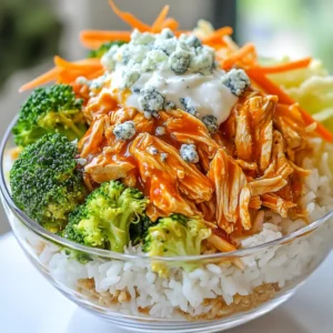 - 2 boneless, skinless chicken breasts - 1/2 cup buffalo sauce - 1 teaspoon olive oil - 1 cup cooked brown rice or cauliflower rice - 1 cup broccoli florets - 1/2 cup carrots, shredded - 1/2 cup celery, diced - 1/4 cup blue cheese crumbles - 2 tablespoons Greek yogurt - 1 tablespoon fresh parsley - Salt and pepper to taste Buffalo Chicken Bowls shine thanks to their simple yet bold flavors. You need just a few items to create this flavorful meal. The chicken serves as the star, soaking up that tangy buffalo sauce. I love using two boneless, skinless chicken breasts for this dish. They are easy to cook and shred. The buffalo sauce brings the heat, so choose your favorite brand or make your own. A teaspoon of olive oil helps the chicken brown nicely in the pan. For the base, I often use a cup of cooked brown rice, but cauliflower rice is a great low-carb swap. It adds a nice texture while keeping it light. The veggies add color and nutrition. I like to use broccoli, shredded carrots, and diced celery. They add crunch and freshness. Finally, the toppings make the dish pop. Blue cheese crumbles add a rich flavor. If you prefer something lighter, Greek yogurt works well too. A sprinkle of fresh parsley on top gives it a beautiful finish. Don’t forget to season with salt and pepper to taste; it ties everything together. With these ingredients, you can whip up a delicious meal in no time! {{ingredient_image_1}} First, we need to cook the chicken. Take two boneless, skinless chicken breasts and season them with salt and pepper. Heat a skillet on medium heat and add one teaspoon of olive oil. When the pan is hot, place the chicken in it. Sear each side for about 5-7 minutes until golden brown. Once the chicken is cooked through, pour in half a cup of buffalo sauce. Cover the skillet with a lid and let it simmer for five minutes. This step lets the chicken soak up all that spicy flavor. After simmering, it’s time to shred the chicken. Carefully remove it from the skillet using tongs. Use two forks to shred the chicken into bite-sized pieces. Return the shredded chicken to the skillet and stir it well in the buffalo sauce. Keep it warm on low heat while you prepare the base. While the chicken simmers, let’s prepare the base. Cook one cup of brown rice or cauliflower rice in a pot according to package instructions. At the same time, steam one cup of broccoli florets and half a cup of shredded carrots. You can do this in a steamer basket or microwave. Now, it’s time to assemble your bowls. Start with a layer of rice at the bottom. Then, add the steamed broccoli, shredded carrots, and the buffalo chicken mixture on top. For the finishing touch, sprinkle a quarter cup of blue cheese crumbles over everything. Add a dollop of two tablespoons of Greek yogurt for creaminess. Finally, top it off with a tablespoon of fresh chopped parsley. Enjoy your colorful and tasty Buffalo Chicken Bowls! To keep chicken juicy, use medium heat and don’t overcook it. Sear the chicken for about 5-7 minutes on each side until golden. After that, pour buffalo sauce over the chicken and cover the skillet. Let it simmer for 5 minutes. This helps the chicken soak up all the flavors. You can adjust the spice level of the buffalo sauce easily. If you like it mild, mix in some Greek yogurt or sour cream. For a spicier kick, add more buffalo sauce or a splash of hot sauce. Taste as you go, so it fits your spice preference. Using clear glassware makes your buffalo chicken bowls look great. You can see all the colorful layers of rice, veggies, and chicken. It’s like a work of art! For added flair, drizzle a little buffalo sauce on top before serving. This not only enhances the look but also adds more flavor. A sprinkle of fresh parsley on top gives a nice touch too. Pro Tips Adjust the Heat: If you prefer a milder flavor, mix the buffalo sauce with a little honey or barbecue sauce to balance the heat. Cook Chicken Evenly: For perfectly cooked chicken, make sure to pound the breasts to an even thickness before cooking. Meal Prep Friendly: This dish is great for meal prep! Store components separately and assemble when ready to eat for fresh flavors. Customization is Key: Feel free to add other veggies like bell peppers or swap out the blue cheese for feta or a dairy-free alternative! {{image_2}} You can make a low-carb version of Buffalo Chicken Bowls. Simply swap out the brown rice for cauliflower rice. Cauliflower rice has a light texture and absorbs flavors well. It cuts down on carbs while keeping the dish tasty. To prepare, just pulse cauliflower florets in a food processor until they resemble rice. Sauté them briefly in a pan until tender and serve as the base for your bowl. Want a vegan twist? Replace the chicken with tofu or chickpeas. Tofu provides a nice protein source and absorbs flavors well. Cut it into cubes and sauté until golden. If you prefer chickpeas, use canned ones. Just rinse and heat them before adding to the bowl. For toppings, use a dairy-free alternative for blue cheese. You can use cashew cheese or a store-bought vegan option. For creaminess, swap Greek yogurt with a dairy-free yogurt or avocado. Don’t be afraid to mix it up! Experiment with different sauces. Barbecue sauce can give a sweet and smoky flavor. You can also try teriyaki or sriracha for a different kick. Adding more veggies can enhance the flavor and nutrition. Try bell peppers, spinach, or corn. Fresh herbs like cilantro or green onions can add a nice touch as well. Get creative and find the combination you love! To store your Buffalo Chicken Bowls, first let them cool. Place leftovers in airtight containers. This keeps them fresh and safe to eat later. Use containers that are BPA-free. Glass or plastic containers work well. Be sure to label each container with the date. This way, you can keep track of when you made them. Try to eat leftovers within three to four days for the best taste. When reheating, avoid using a microwave if possible. Instead, use a skillet on low heat. Add a splash of water or broth to keep the chicken moist. Stir often to make sure everything heats evenly. If you use a microwave, cover the bowl with a wet paper towel. This helps trap steam and keeps the food from drying out. Always check that the chicken is heated all the way through. You can make buffalo sauce at home. Simply mix hot sauce with butter. This creates a rich and spicy sauce. If you want a milder option, consider using barbecue sauce. You can mix it with a little hot sauce for a gentle kick. Another choice is to use sriracha or a sweet chili sauce, which has a nice balance of heat and sweetness. Yes! You can prep Buffalo Chicken Bowls in advance. Cook the chicken and shred it. Store it in the fridge for up to three days. You can also prepare the rice and veggies ahead of time. Keep them separate to maintain freshness. When ready to eat, just reheat the chicken and assemble your bowls. This makes weeknight meals quick and easy. To add more heat, use extra buffalo sauce. You can also sprinkle in some red pepper flakes. If you want a real kick, try adding diced jalapeños. For a smoky flavor, chipotle sauce works well too. Just remember to taste as you go to find your perfect spice level. This blog post covered how to make delicious Buffalo Chicken Bowls. You learned about the main ingredients, step-by-step cooking, helpful tips, and fun variations. Whether you want a low-carb meal or a vegan option, there are many ways to customize this dish. In conclusion, enjoy trying out different flavors and ingredients. With these easy steps, anyone can make a tasty meal. Don’t forget to store leftovers for later and think of ways to spice it up!