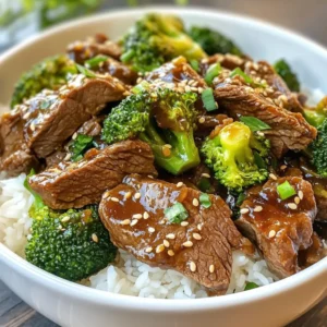 - 1.5 lbs flank steak, sliced against the grain - 2 cups broccoli florets - 1 cup beef broth - 1/4 cup soy sauce (or tamari for gluten-free) - 2 tablespoons brown sugar - 2 tablespoons cornstarch (plus 1 tablespoon for thickening) - 1 tablespoon garlic, minced - 1 tablespoon ginger, minced - 2 tablespoons sesame oil - 1 tablespoon sesame seeds (for garnish) - Cooked rice or noodles (for serving) For this dish, I love using flank steak. It has great flavor and gets very tender in the crockpot. The broccoli brings a nice crunch and bright color. The beef broth adds depth. Soy sauce or tamari gives it that rich umami taste. Brown sugar rounds out the flavors, making it sweet and savory. Don't forget the cornstarch! It helps to thicken the sauce. Garlic and ginger are must-haves for a punch of flavor. Sesame oil adds a lovely nuttiness. Finally, sesame seeds make the dish look pretty when you serve it over rice or noodles. {{ingredient_image_1}} - Slicing the flank steak: Start with 1.5 lbs of flank steak. Slice it against the grain into thin strips. This helps the beef stay tender. - Measuring out liquids and seasonings: In a bowl, measure 1 cup of beef broth and 1/4 cup of soy sauce. Add 2 tablespoons of brown sugar, 1 tablespoon of minced garlic, and 1 tablespoon of minced ginger. Finally, pour in 2 tablespoons of sesame oil. Whisk these together until well mixed. - Layering ingredients in the crockpot: Place the sliced flank steak at the bottom of the crockpot. Pour the sauce mixture over the beef. Make sure all the meat is coated well. - Cooking times for low and high settings: Cover the crockpot. Cook on low for about 6-7 hours. If you're short on time, cook on high for 3-4 hours. The beef should be tender when done. - Thickening the sauce with cornstarch: About 30 minutes before the dish is ready, mix 1 tablespoon of cornstarch with 2 tablespoons of water. This creates a slurry. Stir it into the crockpot. This will help thicken the sauce. - Adding broccoli at the right time: Add 2 cups of broccoli florets to the crockpot during the last 15 minutes. Stir gently to combine. Cover again to let the broccoli steam and become tender. Marinating the beef makes a big difference. I suggest marinating it for at least an hour. You can mix soy sauce, garlic, ginger, and a bit of brown sugar. This helps the beef soak up all the great flavors. Adjust the sweetness by adding more or less brown sugar. If you prefer a sweeter taste, add a little more. To avoid mushy broccoli, add it near the end of cooking. I recommend adding broccoli florets in the last 15 minutes. This keeps them bright and crisp. For the best sauce, use cornstarch to thicken it. Mix one tablespoon of cornstarch with water to make a slurry. Stir this into the sauce about half an hour before it's done. This gives you a nice, thick sauce. Cooked rice or noodles go great with this dish. They soak up the sauce well. For a touch of color, sprinkle sesame seeds on top. You can also add chopped green onions for a fresh look. Serve it all in deep bowls for a cozy feel. A drizzle of extra sesame oil adds flavor and shine. Pro Tips Cutting the Beef: Always slice the flank steak against the grain for maximum tenderness. Broccoli Timing: Add the broccoli during the last 15 minutes to retain its bright color and crunch. Thickening the Sauce: For a thicker sauce, allow the cornstarch slurry to simmer for a few minutes after adding it to the crockpot. Serving Suggestions: Pair with jasmine rice or udon noodles for a more authentic Asian-inspired meal. {{image_2}} You can switch flank steak with chicken or tofu. Chicken will cook fast. Use boneless, skinless chicken thighs or breasts. For tofu, choose firm or extra-firm. Cut it into cubes for the best texture. Adjust your cooking time based on the protein. Cook chicken on low for 4-5 hours or high for 2-3 hours. Tofu needs less time. Cook it on low for about 3 hours. Add fun veggies to your dish! Bell peppers bring sweetness, while carrots add crunch. Slice them thin to cook well in the crockpot. You can mix them in at the same time as broccoli. Want more heat? Add chili flakes or a splash of sriracha. Start with a small amount, then taste. You can always add more if you like it spicy! Make this dish gluten-free easily. Swap soy sauce for tamari. It has the same great taste without gluten. For low-sodium options, use low-sodium beef broth and soy sauce. You can also cut back on the brown sugar for a healthier twist. If you want it low-carb, skip the rice or noodles and serve it over steamed veggies instead. After enjoying your beef and broccoli, store any leftovers properly. Here are some best practices: - Refrigeration: Place the cooled dish in an airtight container. This keeps the food fresh for up to 3-4 days. Always label your container with the date. - Freezing: If you want to keep it longer, freeze the leftovers. Use freezer-safe bags or containers. Properly sealed, it can last up to 3 months. Make sure to remove as much air as possible to prevent freezer burn. When it's time to enjoy your leftovers, you have a couple of easy options. - Microwave: This method is quick and simple. Place your portion in a bowl. Cover it loosely with a lid or wrap. Heat for 1-2 minutes, stirring halfway. Check that it is hot all the way through. - Stovetop: For better texture, use the stovetop. Place your beef and broccoli in a pan over medium heat. Stir it gently. Add a splash of water or broth if it seems dry. Heat for about 5-7 minutes until warmed through. Keep these tips in mind to ensure your dish stays flavorful and enjoyable! Crockpot Beef and Broccoli takes 6-7 hours on low and 3-4 hours on high. Cooking on low gives the beef more time to become tender. If you're in a hurry, high will still yield great results. Yes, you can use frozen broccoli. However, it may change the texture. It can make the broccoli softer. If using frozen, add it during the last 15-20 minutes of cooking. This helps it warm through without getting too mushy. Crockpot Beef and Broccoli pairs well with several sides. Here are some ideas: - Steamed rice: White or brown rice absorbs the sauce well. - Noodles: Rice noodles or egg noodles are great choices. - Vegetable stir-fry: Lightly stir-fried veggies can add freshness. - Salad: A simple green salad can balance the meal. These options enhance your meal's flavor and texture. This blog post guided you through making Crockpot Beef and Broccoli. We covered key ingredients, step-by-step preparation, and cooking tips. You learned how to adjust flavors and textures to enhance the dish. We also discussed variations for different diets and the best storage solutions. Now you can create a delicious meal with ease. Enjoy your cooking and share this flavorful dish with friends!