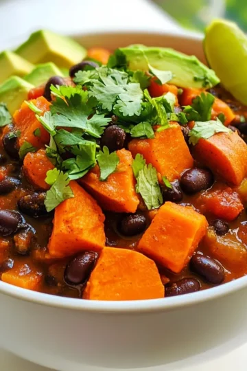 - 2 medium sweet potatoes, peeled and diced - 1 can (15 oz) black beans, drained and rinsed - 1 can (14 oz) diced tomatoes (with juices) - 1 medium onion, diced - 3 cloves garlic, minced - 1 bell pepper (red or green), diced - 2 cups vegetable broth - 2 teaspoons ground cumin - 1 teaspoon smoked paprika - 1 teaspoon chili powder - ½ teaspoon cayenne pepper (adjust to taste) - Salt and pepper to taste - 1 tablespoon olive oil - Fresh cilantro, chopped (for garnish) - Avocado slices (for serving) - Lime wedges (for serving) Sweet potatoes bring a sweet taste and nice texture to this chili. Black beans add protein and fiber. Diced tomatoes add moisture and flavor. The onion, garlic, and bell pepper give a great base. Vegetable broth makes it all come together. Spices make this dish pop. Cumin adds warmth. Smoked paprika adds a slight smokiness. Chili powder gives heat, while cayenne pepper adds a kick. You can adjust the cayenne to your taste. Olive oil helps to sauté the vegetables. Fresh cilantro gives a burst of color and flavor. Avocado slices add creaminess, and lime wedges add brightness. This combination makes a hearty meal. 1. Start by heating olive oil in a large pot over medium heat. 2. Add the diced onion and bell pepper. Sauté until soft, about 5 minutes. 3. Next, stir in the minced garlic. Cook for another 1-2 minutes, but don’t let it burn. 1. Now, add the diced sweet potatoes, black beans, and diced tomatoes with their juices. 2. Pour in the vegetable broth, then sprinkle the ground cumin, smoked paprika, chili powder, cayenne pepper, salt, and pepper. 3. Bring everything to a boil. After it boils, lower the heat and cover the pot. 4. Let the chili simmer for 25-30 minutes. Stir occasionally until the sweet potatoes are tender. 1. Taste your chili. Adjust the seasoning if needed, adding salt, pepper, or spices. 2. Serve the chili hot. Garnish with fresh cilantro and avocado slices. Add lime wedges for a zesty kick. - Best practices for softening sweet potatoes: Cut sweet potatoes into small, even pieces. This helps them cook faster and become tender. Cook them in the chili from the start. The simmering chili will soften them well. You can also boil them for 10 minutes before adding them to the pot. - How to prevent burning the garlic: Add garlic after the onion and bell pepper start to soften. Cook the garlic for just 1-2 minutes. Stir it often and watch it closely. If it starts to brown too much, lower the heat. Burnt garlic tastes bitter, so keep it fresh and fragrant. - Serving suggestions with garnishes: Serve the chili in bright bowls. Top each bowl with fresh cilantro and avocado slices. Squeeze fresh lime juice on top for a zesty kick. This adds color and flavor. - Bowl and plate ideas for aesthetic appeal: Choose colorful bowls to make the dish pop. A deep bowl highlights the chili's texture. Use small plates for lime wedges and extra toppings. You can also add a sprinkle of chili powder for a nice touch on the rim of the bowl. {{image_2}} You can mix up the beans in this chili. Try kidney beans or pinto beans instead of black beans. You can also add more veggies. Zucchini, corn, or spinach work great in this dish. For extra protein, ground turkey or tofu makes a nice addition. Just brown the turkey first or press the tofu to remove extra water before adding it to the pot. Do you want more heat? Add more cayenne pepper or some diced jalapeños. If you prefer it milder, skip the cayenne and reduce the chili powder. You can also use sweet paprika instead of smoked paprika for a softer flavor. This chili is easy to make gluten-free. Just use gluten-free vegetable broth, and you're set. If you want vegan options, skip the ground turkey or tofu. You can also add more beans or veggies to keep it hearty and satisfying. Store leftover chili in an airtight container. Make sure it cools down first. This keeps flavors fresh. Use glass or plastic containers that seal well. Label with the date for easy tracking. To reheat, the stovetop works best. Heat on low, stirring often. This way, it warms evenly. If you choose the microwave, use a microwave-safe bowl. Stir halfway through to avoid hot spots. You can freeze this chili for later meals. Let it cool completely before freezing. Use freezer-safe bags or containers. Remove as much air as possible to prevent freezer burn. To thaw, place it in the fridge overnight. Reheat on the stovetop or microwave until hot. Yes, you can make this chili in a slow cooker. Start by sautéing the onion and bell pepper in a pan. After that, add all the ingredients to the slow cooker. Cook on low for 6-8 hours or on high for 3-4 hours. This method makes the flavors blend well and keeps your kitchen cool. You can store leftovers in the refrigerator for up to 5 days. Make sure to put the chili in an airtight container. This keeps it fresh and safe to eat. This chili pairs well with many sides. You can serve it with rice or cornbread. Toppings like avocado, lime, or cilantro add flavor. A fresh salad can also balance the meal. Yes, you can use fresh tomatoes instead of canned. Just chop about 2-3 medium tomatoes. Add them to the pot with some extra broth, as fresh tomatoes have more water. Absolutely! This chili is great for meal prep. It stores well and tastes even better the next day. You can pack it in single servings for easy lunches or dinners throughout the week. This blog post covered the key elements of making Sweet Potato Black Bean Chili. You learned about the best ingredients, step-by-step cooking, and tips for perfect taste. I shared ideas for variations and how to store leftovers. Remember, your chili can change based on your taste and needs. Enjoy experimenting with spices or adding protein! This dish is not just tasty; it’s also healthy and easy to make. Dive in, get creative, and serve up a bowlful of comfort!