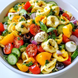- 12 ounces cheese tortellini - 1 cup cherry tomatoes, halved - 1 cup cucumber, diced - 1 bell pepper (red or yellow), diced - ½ red onion, finely chopped - ½ cup black olives, sliced - ½ cup mozzarella balls, halved - ¼ cup fresh basil, chopped You need the right ingredients for a great Italian tortellini pasta salad. Start with cheese tortellini. It adds a rich, creamy taste. Then, gather fresh, colorful veggies. Cherry tomatoes give a sweet burst. Cucumbers add crunch. Bell peppers bring color and flavor. Don’t forget the red onion for a sharp bite. Black olives add a salty touch. Finally, mozzarella balls provide a soft, chewy texture. Fresh basil adds a nice herbal note. - ¼ cup olive oil - 2 tablespoons balsamic vinegar The dressing is simple but full of flavor. Use high-quality olive oil for richness. Balsamic vinegar adds acidity and sweetness. This mix elevates the salad and ties it all together. - 1 teaspoon dried oregano - Salt and pepper to taste Seasoning is key to making the flavors pop. Dried oregano gives a classic Italian taste. Salt and pepper are essential for overall flavor balance. Adjust these to your liking to make every bite delicious. {{ingredient_image_1}} Start by bringing a large pot of salted water to a boil. The salt helps flavor the pasta. Once the water is boiling, add 12 ounces of cheese tortellini. Cook them for about 4 to 5 minutes. You want them to be al dente, which means they should be firm but cooked. After they are done, drain the tortellini and rinse them under cold water. This stops the cooking and cools them down. In a large mixing bowl, combine the cooked tortellini with other fresh ingredients. Add 1 cup of halved cherry tomatoes, 1 cup of diced cucumber, and 1 diced bell pepper. You can use red or yellow for a pop of color. Next, add ½ cup of finely chopped red onion, ½ cup of sliced black olives, and ½ cup of halved mozzarella balls. Finally, toss in ¼ cup of chopped fresh basil for a burst of flavor. Mix everything gently so it combines well. In a small bowl, whisk together the dressing ingredients. Start with ¼ cup of olive oil and 2 tablespoons of balsamic vinegar. Then, add 1 teaspoon of dried oregano, along with salt and pepper to taste. Whisk until the mixture is well combined. This dressing will bring all the flavors together. Pour the dressing over the salad mixture. Toss everything gently until all the ingredients are coated with the dressing. This helps each bite burst with flavor. Cover the salad and place it in the refrigerator for at least 30 minutes. This waiting time allows the flavors to meld. You can serve it chilled or at room temperature. Enjoy your fresh and flavorful Italian tortellini pasta salad! To make great tortellini, cook it just right. For an al dente texture, boil it for 4 to 5 minutes. Check the package for the exact time. If you cook it too long, it may become mushy. After cooking, drain and rinse it with cold water. This stops the cooking and keeps it firm. You can add more flavor to your salad. Try adding grated parmesan cheese for a rich taste. Garlic can also boost the flavor. Just a little minced garlic goes a long way. Feel free to add your favorite herbs too. Fresh parsley or basil will brighten the dish. A beautiful salad is always more inviting. Serve your tortellini salad in a large bowl. Garnish it with extra basil leaves on top. You can drizzle a bit of balsamic vinegar for a nice look. Use colorful plates to make the dish pop. A sprinkle of black olives adds contrast and charm. Pro Tips Fresh Ingredients: Use the freshest vegetables you can find for the best flavor and texture in your salad. Make Ahead: Prepare the salad a few hours in advance or the night before to allow the flavors to develop. Customizable: Feel free to swap out the vegetables or add proteins like grilled chicken or salami for a heartier dish. Serving Size: This salad serves well as a side dish or main course, adjust the serving sizes accordingly based on your meal. {{image_2}} You can make your Italian Tortellini Pasta Salad even more colorful and healthy by adding more vegetables. Try mixing in some spinach or arugula for a fresh bite. You can also choose zucchini or bell peppers for a crunchy texture. If you want protein, consider adding chickpeas or black beans. They add fiber and help make the dish more filling. If you want to add more protein, think about using chicken, shrimp, or even tofu. Grilled chicken adds great flavor. Shrimp can offer a nice twist, bringing a seafood element to your salad. For a plant-based option, try cubed tofu. Marinate it in soy sauce for extra taste before adding it to your salad. The dressing can change the whole vibe of your salad. A simple vinaigrette made with olive oil, lemon juice, and herbs is light and zesty. For a creamier texture, try a ranch or Caesar dressing. You can even mix yogurt with herbs for a tangy twist. Experimenting with different dressings can lead to exciting new flavors. To keep your Italian Tortellini Pasta Salad fresh, store it in an airtight container. This helps prevent the salad from drying out. Place the container in the fridge as soon as you finish serving. Make sure to keep the dressing separate if you plan to store leftovers. This way, the salad stays crunchy. This salad is best served cold, so you don't need to reheat it. If you have leftovers, just take them out of the fridge. Toss the salad lightly to mix everything again. You can add a splash of olive oil or vinegar for extra flavor if needed. The salad lasts about 3 to 5 days in the fridge. After that, the ingredients may start to lose their taste and texture. If you see any signs of spoilage, like a strange smell or slimy veggies, it’s best to throw it away. Enjoy your delicious salad while it is fresh! Tortellini is a small pasta, often stuffed with cheese. The dough is made from flour and eggs. You can find different types, like cheese, meat, or even spinach. Each type adds a unique taste and texture to your dish. Yes, you can make this salad ahead of time. It tastes better after resting in the fridge. To prep in advance, cook the tortellini and chop the veggies. Mix them, but wait to add the dressing. This keeps everything fresh. Cover the salad and store it in the fridge. Just add the dressing just before serving. No, regular tortellini is not gluten-free. However, you can find gluten-free tortellini made from rice or corn. This way, you can enjoy the salad without gluten. Just check the package for gluten-free labels when you shop. This pasta salad combines cheese tortellini and fresh vegetables for a tasty dish. We covered the key ingredients, dressing components, and seasoning to boost flavor. I shared steps to cook and mix everything perfectly. You have useful tips for cooking and serving. You can also make variations that fit your taste. Remember, store it right to keep it fresh! Whether you serve it right away or save some for later, enjoy this quick and easy salad. It’s a fun way to eat well!