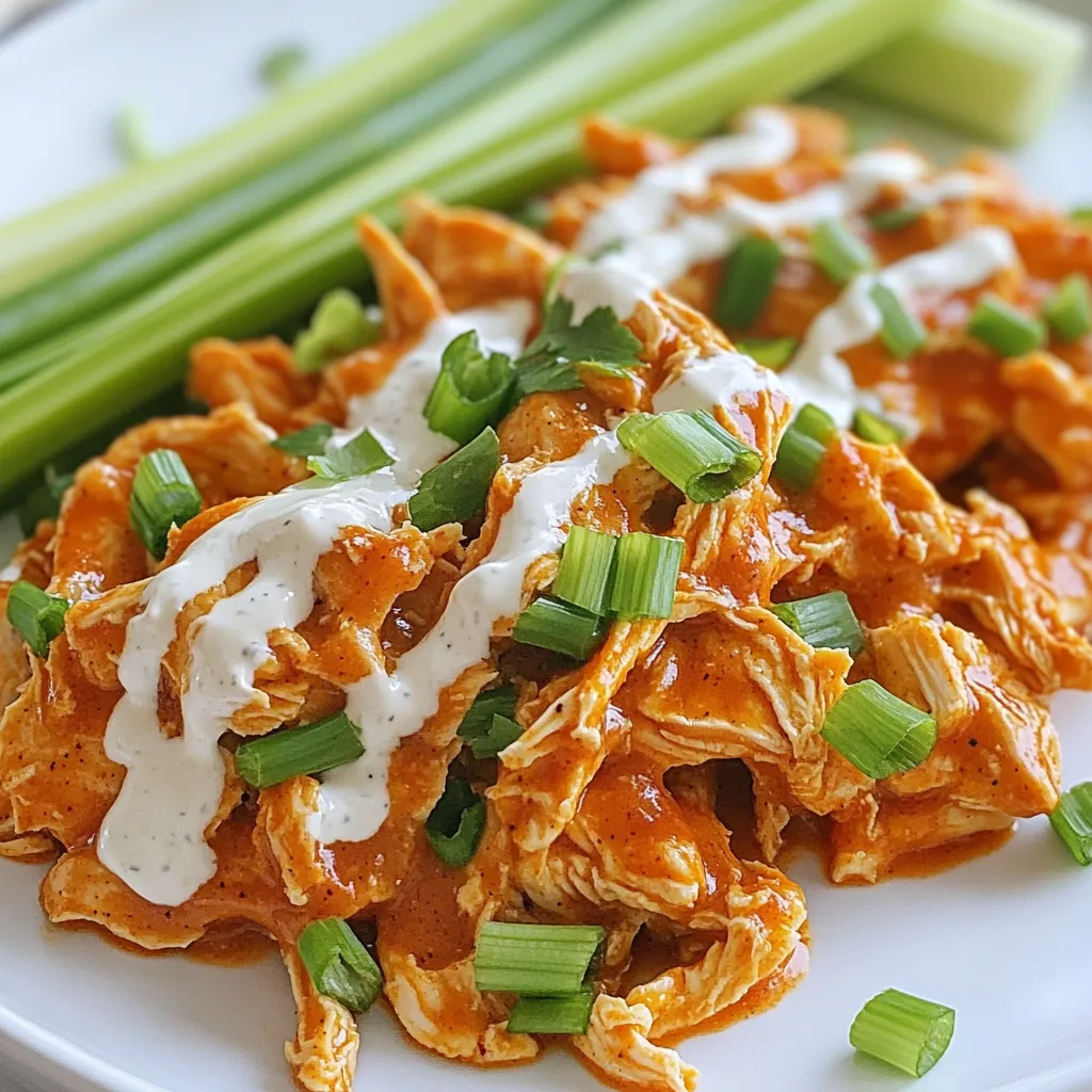 - 2 lbs boneless, skinless chicken breasts - 1 cup buffalo sauce (mild or hot based on preference) - ½ cup chicken broth - 1 tablespoon garlic powder - 1 tablespoon onion powder - 1 teaspoon smoked paprika - 1 teaspoon salt - ½ teaspoon black pepper - ¼ cup ranch dressing (for serving) - Green onions, chopped (for garnish) - Celery sticks (for serving) When it comes to making slow cooker buffalo chicken, the right ingredients matter. You need fresh, boneless chicken breasts for the best texture. The buffalo sauce is key for flavor. Choose a sauce that matches your heat level. I often use mild for a family-friendly dish or hot for a spicy kick. While chicken broth adds depth, you can use low-sodium broth if you watch your salt. Garlic powder and onion powder bring great taste without extra work. Smoked paprika gives a nice, warm flavor. Don’t skip the salt and black pepper; they balance the dish. Ranch dressing is perfect for serving. It cools the heat from the buffalo sauce. Chopped green onions add a fresh touch. Finally, celery sticks are classic. They give crunch and a refreshing bite. - You can use chicken thighs instead of breasts for a richer flavor. - If you want to make your own buffalo sauce, mix hot sauce with melted butter. - For a lighter meal, swap in vegetable broth for chicken broth. These swaps can change your dish while keeping it tasty. You can always play around with these ingredients to suit your taste! {{ingredient_image_1}} - Preparing the Chicken: Start by placing 2 lbs of boneless, skinless chicken breasts in the bottom of your slow cooker. Make sure they lay flat and do not overlap. This helps them cook evenly. - Mixing the Sauce: In a separate bowl, combine 1 cup of buffalo sauce, ½ cup of chicken broth, 1 tablespoon of garlic powder, 1 tablespoon of onion powder, 1 teaspoon of smoked paprika, 1 teaspoon of salt, and ½ teaspoon of black pepper. Stir until everything is well mixed. - Covering and Cooking Times: Pour the sauce mixture over the chicken in the slow cooker. Make sure the chicken is fully coated. Cover the slow cooker with its lid. Set it to cook on low for 6-8 hours or high for 3-4 hours. - Checking for Doneness: After the cooking time is up, check if the chicken is tender. You can do this by using a fork to see if it shreds easily. If it does, it’s ready to go! - How to Properly Shred Chicken: Once the chicken is cooked, use two forks to shred it right in the slow cooker. Mix the shredded chicken with the sauce to soak up all the flavors. - Serving Suggestions and Garnishing Tips: Serve the shredded chicken hot. Drizzle ¼ cup of ranch dressing over the top. Garnish with chopped green onions for color and flavor. Pair it with celery sticks for a classic touch. Enjoy your meal! To keep your chicken juicy, always add enough liquid. The chicken broth is key. If you cook on low for 6-8 hours, the chicken stays moist. Cooking on high for 3-4 hours is faster, but may dry it out. Choose low for the best results. You can boost flavor with extra spices. Try adding cayenne pepper for heat. Smoked paprika adds a nice depth. If you have time, marinate the chicken overnight. This helps the flavors soak in better. Use your favorite buffalo sauce for a unique twist. Buffalo chicken pairs well with celery sticks and ranch dressing. Serve it on a platter for a fun touch. You can also make sliders with buns for easy eating. Top with chopped green onions for color. Don’t forget to have extra ranch on the side! Pro Tips Choose Your Sauce Wisely: The level of spiciness can be easily adjusted by selecting a mild or hot buffalo sauce. Test a small amount before pouring it over the chicken to ensure it matches your taste preference. Maximize Flavor: For deeper flavor, consider marinating the chicken in the buffalo sauce and spices for a few hours or overnight before slow cooking. This allows the chicken to absorb more of the sauce's flavors. Shred with Ease: Make shredding the chicken easier by using a hand mixer on low speed. This technique quickly breaks down the chicken without much effort. Serving Suggestions: Pair the chicken with a variety of sides such as coleslaw, or carrot sticks, in addition to celery. This adds crunch and balances the dish's heat. {{image_2}} To spice up your buffalo chicken, you can use different hot sauces. Each sauce adds a unique flavor and heat level. Try using a blend of hot sauces for a more complex taste. You can also add jalapeños for an extra kick. Slice fresh jalapeños and toss them in the slow cooker. They will add both heat and crunch. If you want a lighter meal, try low-fat versions of the buffalo sauce. You can also use skinless chicken thighs for more flavor without extra fat. For vegetarian or vegan options, use jackfruit or cauliflower. These can mimic the texture of chicken well. Toss them in the same sauce for a delicious meal. Buffalo chicken is great in many forms. You can make sandwiches with crusty bread or soft rolls. Use your shredded chicken as a filling. For a twist, try buffalo chicken wraps or tacos. Use lettuce leaves or tortillas to hold the chicken. Add veggies and drizzle ranch dressing on top for more flavor. To keep your buffalo chicken fresh, store it in a tight container. Glass or plastic containers with lids work well. Let the chicken cool down before sealing it. This helps prevent steam from building up inside. You can keep it in the fridge for up to four days. If you want to enjoy it later, make sure it cools completely before refrigerating. You can freeze buffalo chicken for later meals. Place it in a freezer-safe bag or container. Remove as much air as possible before sealing. This helps prevent freezer burn. It will stay good in the freezer for up to three months. When you’re ready to eat it, thaw it overnight in the fridge. For reheating, microwave it or warm it on the stove with a bit of broth. This keeps it moist and tasty. Buffalo chicken lasts about four days in the refrigerator. If frozen, it can last for three months. Always check for any off smells or changes in color. If you notice anything unusual, it’s best to throw it away. Keeping track of the date you cooked it helps ensure safety. To make Slow Cooker Buffalo Chicken, start by preparing the chicken. Place 2 lbs of boneless, skinless chicken breasts in the slow cooker. Next, mix your sauce in a bowl. Combine 1 cup of buffalo sauce, ½ cup of chicken broth, and spices: 1 tablespoon garlic powder, 1 tablespoon onion powder, 1 teaspoon smoked paprika, 1 teaspoon salt, and ½ teaspoon black pepper. Pour this sauce over the chicken, making sure to coat it well. Cover the slow cooker and cook on low for 6-8 hours or high for 3-4 hours. The chicken will become tender and easy to shred. Once done, shred the chicken with two forks right in the cooker. This mixes it with the sauce. Serve it hot with ranch dressing and chopped green onions on top. Yes, you can use frozen chicken in the slow cooker. However, it’s best to use smaller pieces, like chicken breasts. This helps them cook evenly. When cooking with frozen chicken, add around 1-2 hours to the cooking time. Make sure the chicken reaches a safe temperature of 165°F. To be safe, check the chicken’s doneness with a food thermometer. Buffalo Chicken pairs well with several sides. Here are some great options: - Celery sticks - Carrot sticks - Coleslaw - Cornbread - Rice or quinoa - French fries or chips These sides will balance the spicy flavor and create a complete meal. To adjust the spice level of your Buffalo Chicken, here are some tips: - For a milder dish, use a mild buffalo sauce. - Add more chicken broth to dilute the heat. - Mix in a bit of cream cheese or sour cream for a creamy texture. - For more heat, add extra buffalo sauce or a dash of cayenne pepper. Experiment until you find your perfect spice level! In this blog post, we explored the steps to make delicious buffalo chicken. We covered key ingredients, cooking tips, and serving ideas. You can customize with alternatives and variations based on your taste. From spicy twists to healthier options, there’s something for everyone. Storing your leftovers properly maximizes flavor and freshness. Use this guide to create a meal that is simple and satisfying. Enjoy your buffalo chicken adventure!