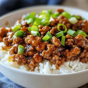 For this dish, you need: - 1 lb ground turkey - 3 tablespoons honey - 3 cloves garlic, minced - 2 tablespoons soy sauce (low sodium) - 1 tablespoon rice vinegar - 1 teaspoon grated ginger - 1 tablespoon sesame oil - Salt and pepper to taste - Cooked rice or quinoa (for serving) These ingredients come together to create a sweet and savory base. Ground turkey gives you a lean protein, while honey adds a nice sweetness. Garlic and ginger bring a punch of flavor. The soy sauce and rice vinegar balance the dish with umami and tang. You can make your meal even better with these extras: - 2 green onions, sliced (for garnish) - Sesame seeds (for a crunchy top) Using green onions adds a fresh taste and a pop of color. If you sprinkle sesame seeds, you’ll get a nice crunch too. If you don't have ground turkey, you can use ground chicken or beef. Both work well and give great flavor. For a vegetarian option, try crumbled tofu or tempeh. If honey is not available, maple syrup can give a similar sweetness. You can also swap soy sauce for tamari for a gluten-free version. Always taste as you go to adjust seasonings. {{ingredient_image_1}} To start, gather your ingredients. You need ground turkey, honey, garlic, soy sauce, rice vinegar, and ginger. In a medium bowl, combine the ground turkey with three tablespoons of honey. Add three minced cloves of garlic, two tablespoons of low-sodium soy sauce, one tablespoon of rice vinegar, and one teaspoon of grated ginger. Mix all the ingredients until they blend well together. This step is crucial; it builds the flavor foundation for your dish. Next, heat one tablespoon of sesame oil in a large skillet over medium heat. You want the oil to be hot but not smoking. Add the seasoned ground turkey mixture to the skillet. Use a wooden spoon to break apart the meat as it cooks. Cook for about 7 to 10 minutes, stirring often. The turkey should be fully cooked and no longer pink. For a deeper flavor, let it cook for an extra 2 to 3 minutes until it caramelizes slightly. Taste the mixture and add salt and pepper to your liking. Once the turkey is cooked, remove it from heat and let it cool for about a minute. Serve it over a bed of cooked rice or quinoa. This adds a nice texture to the dish. For a pop of color, garnish with sliced green onions on top. You can also sprinkle sesame seeds for extra crunch. Serving in a deep bowl or plate creates an appealing layered look. Enjoy your flavorful and easy honey garlic ground turkey! To get the best flavor from your Honey Garlic Ground Turkey, use fresh ingredients. Fresh garlic and ginger add a lot of taste. Mix the honey with soy sauce and rice vinegar for a sweet and tangy kick. If you want more depth, let the turkey cook a bit longer. This caramelizes the sauce, giving it a rich color and taste. If you're new to cooking, start by gathering all your ingredients first. This makes the process smooth and easy. When cooking the turkey, break it apart with a wooden spoon. Cook until it is no longer pink. This usually takes about 7 to 10 minutes. Taste as you go! Adjust the seasoning with salt and pepper to match your liking. For a restaurant-style look, serve your dish in a deep bowl or a nice plate. This adds layers and makes the meal pop. Top it with sliced green onions for color. You can also sprinkle sesame seeds on top for a crunchy finish. Serve the turkey over a bed of rice or quinoa for a complete look. This not only tastes great but also looks appealing to the eyes. Pro Tips Adjust the Sweetness: If you prefer a less sweet dish, reduce the amount of honey to your taste or substitute with a sugar alternative. Enhance the Umami Flavor: Adding a splash of fish sauce can deepen the savory notes in the dish without overpowering it. Use Fresh Ingredients: Fresh garlic and ginger will provide a brighter flavor compared to pre-minced varieties, enhancing the dish's overall taste. Meal Prep Friendly: This dish can be made in advance and stored in the fridge for up to 3 days, making it perfect for meal prep! {{image_2}} You can swap ground turkey for other meats. Ground chicken works well for a lighter taste. If you want beef, use ground sirloin for a richer flavor. For a vegetarian option, try using lentils or crumbled tempeh. Both add great texture and absorb the honey garlic sauce. For gluten-free diets, use tamari instead of soy sauce. This keeps the flavors without any gluten. If you avoid sugar, use a sugar substitute like stevia or monk fruit sweetener. You can also use cauliflower rice for a low-carb meal. Want to kick up the flavor? Add a dash of red pepper flakes for heat. You can also mix in chopped bell peppers or snap peas for crunch. For a fresh taste, toss in some cilantro or basil just before serving. These add-ins make this dish even more exciting and colorful! To store leftovers, let the dish cool first. Place it in an airtight container. You can keep it in the fridge for up to three days. Make sure to label the container with the date. When reheating, use a skillet for the best texture. Heat over low to medium heat. Stir occasionally to warm it evenly. You can also add a splash of water or broth to keep it moist. For long-term storage, freeze the dish in a freezer-safe container. It can last up to three months. When ready to eat, thaw in the fridge overnight. Reheat thoroughly before serving. Yes, you can use ground chicken or beef. Both options work well. Ground pork can also add a nice flavor. Just keep the cooking time similar. Absolutely! Honey garlic ground turkey is perfect for meal prep. It stores well in the fridge for up to four days. You can easily make a big batch and divide it into containers. Great sides include steamed broccoli, green beans, or a fresh salad. You can also serve it over rice or quinoa. These options add color and nutrition to your meal. To add heat, mix in crushed red pepper flakes or sriracha. You can also use a spicy soy sauce. Adjust the amount based on your spice level preference. Yes, you can prepare it ahead of time. Cook the turkey and store it in the fridge. Just reheat it before serving. This way, you can enjoy the party too! In this blog post, we explored a tasty recipe for Honey Garlic Ground Turkey. We covered main ingredients, helpful cooking tips, and fun variations. You learned how to store leftovers and how to spice things up. Remember, cooking can be simple and enjoyable. Use this recipe to delight your family or impress friends. Try different proteins or garnishes to make it your own. Enjoy your cooking journey!
