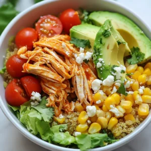 To make a great Buffalo Chicken Power Bowl, you'll need these key items: - 2 cups cooked quinoa - 1 pound boneless, skinless chicken breasts - ½ cup buffalo sauce (store-bought or homemade) - 1 tablespoon olive oil - 1 teaspoon garlic powder - 1 teaspoon onion powder - Salt and pepper to taste - 1 cup cherry tomatoes, halved - 1 cup cooked corn (fresh or frozen) - 1 avocado, sliced - 1 cup shredded romaine lettuce - ½ cup feta cheese, crumbled - Fresh cilantro or parsley for garnish These ingredients give the bowl its tasty flavor and healthy boost. Starting with quinoa keeps the base nutritious and filling. Chicken adds protein, while buffalo sauce brings a spicy kick. Fresh veggies like tomatoes and avocado add color and texture. Lastly, feta cheese and herbs give it a nice finish. You can make your Buffalo Chicken Power Bowls even better with these tasty additions: - Sliced jalapeños for heat - Greek yogurt or sour cream for creaminess - Chopped green onions for a fresh crunch - Extra buffalo sauce for spice lovers Feel free to mix and match toppings. They can change the dish's flavor and vibe. If you have dietary needs, here are some swaps you can try: - Use brown rice or cauliflower rice instead of quinoa for a different grain. - Swap out chicken for tofu, chickpeas, or tempeh for a plant-based option. - Use a dairy-free cheese instead of feta for a vegan bowl. - Choose low-sodium buffalo sauce if you want to cut back on salt. These options help everyone enjoy Buffalo Chicken Power Bowls. You can keep the flavors while making it fit your needs. {{ingredient_image_1}} Start by gathering all your ingredients. You need: - 2 cups cooked quinoa - 1 pound boneless, skinless chicken breasts - ½ cup buffalo sauce - 1 tablespoon olive oil - 1 teaspoon garlic powder - 1 teaspoon onion powder - Salt and pepper - 1 cup cherry tomatoes, halved - 1 cup cooked corn - 1 avocado, sliced - 1 cup shredded romaine lettuce - ½ cup feta cheese, crumbled - Fresh cilantro or parsley Next, preheat your oven to 400°F (200°C). This step helps cook the chicken evenly. While the oven heats, mix olive oil, buffalo sauce, garlic powder, onion powder, salt, and pepper in a bowl. Coat the chicken breasts with this marinade. Let it sit for 10 minutes to soak up the flavors. After marinating, place the chicken on a baking sheet. Bake it for 20 to 25 minutes. The chicken is done when it reaches 165°F (75°C). This step is crucial for food safety. Once cooked, let the chicken rest for 5 minutes. This makes it easier to shred. Use two forks to pull the chicken apart into bite-sized pieces. Now it’s time to build your power bowl! Start with a base of fluffy quinoa. Top it with the shredded buffalo chicken. Then, add halved cherry tomatoes, cooked corn, sliced avocado, and shredded romaine lettuce. Each layer brings a burst of flavor and texture. Finally, sprinkle crumbled feta cheese on top. For a finishing touch, garnish with fresh cilantro or parsley. If you like extra heat, drizzle a bit more buffalo sauce over the top. Enjoy your tasty Buffalo Chicken Power Bowl! To make your chicken burst with flavor, marinate it right. Mix olive oil, buffalo sauce, garlic powder, onion powder, salt, and pepper. Let it sit for at least 10 minutes. This helps the spices soak in. Bake your chicken at 400°F (200°C) for 20-25 minutes. This high heat locks in juices. Use a meat thermometer to check that it hits 165°F (75°C). Let the chicken rest before shredding. This keeps it moist and tender. Cooking quinoa is simple. Rinse it under cold water first to remove bitterness. Use a 2:1 water-to-quinoa ratio. For every cup of quinoa, add two cups of water. Bring it to a boil, then lower the heat. Cover and simmer for 15 minutes. After it’s done, fluff it with a fork. This makes it light and fluffy. If you want extra flavor, cook it in chicken broth instead of water. For the best power bowl, start with a base of quinoa. Layer on shredded buffalo chicken, then add cherry tomatoes, corn, and avocado. Finish with romaine lettuce and feta cheese. Garnish with fresh cilantro or parsley. If you like it spicy, drizzle extra buffalo sauce on top. This adds a kick and makes each bite exciting. Enjoy it fresh or make it a meal prep favorite! Pro Tips Marinating Time: Allow the chicken to marinate for at least 30 minutes if possible. This enhances the flavor and tenderness of the meat. Cooking Quinoa: Rinse quinoa under cold water before cooking to remove its natural coating, which can make it taste bitter. Chicken Shredding: For easier shredding, let the chicken rest for a few minutes after baking. This helps retain moisture. Serving Suggestions: Customize your power bowl with additional toppings like black beans, corn salsa, or your favorite hot sauce for extra flavor. {{image_2}} If you want a meatless meal, try using roasted chickpeas or grilled tofu. Both options add great protein and flavor. You can also use tempeh marinated in buffalo sauce. For a vegan twist, skip the feta cheese or use a dairy-free version. A mix of colorful veggies can make this bowl just as tasty. You don’t need to stick to chicken. Try shredded pork or beef for a different flavor. Grilled shrimp or salmon can also work well. For a plant-based option, use lentils or quinoa for protein. Each choice gives a unique taste while keeping the dish hearty and satisfying. Toppings can make your power bowl shine. Add sliced radishes for crunch and color. A dollop of Greek yogurt or sour cream adds creaminess. You could also sprinkle some chopped green onions for a fresh kick. Experiment with different toppings to find your favorite mix and match! To store your Buffalo Chicken Power Bowls, start by letting them cool. Use airtight containers to keep them fresh. I recommend keeping the chicken and quinoa separate from the veggies. This way, the veggies stay crisp. You can store everything in the fridge for up to three days. If you want to keep them longer, freeze the chicken and quinoa. They last about three months in the freezer. When you’re ready to eat your leftovers, reheat them with care. Use the microwave or a skillet. If using the microwave, cover the bowl with a damp paper towel. This helps keep the moisture in. Heat in short bursts. Stir in between to ensure even heating. If using a skillet, add a splash of water. Cover the pan to steam the food. This keeps the chicken juicy and the quinoa fluffy. Meal prep makes weeknight dinners easy. Cook a batch of quinoa and chicken on the weekend. Store them in separate containers. You can mix and match toppings each night. Try different veggies, like bell peppers or cucumbers. You can also switch up the sauces. A ranch dressing offers a cool twist. This way, you enjoy variety without extra work during the week. Yes, you can prepare these bowls ahead of time. Cook the chicken and quinoa first. Store each part in separate containers. This keeps them fresh. You can mix them together before serving. Just warm the chicken and quinoa in the microwave. Add the fresh toppings like avocado and lettuce just before eating. This way, they stay crisp and tasty. Making buffalo sauce at home is easy. You need just a few ingredients. Start with ½ cup of hot sauce. I like to use Frank's RedHot. Then, melt ¼ cup of unsalted butter in a pan. Mix in the hot sauce and add 1 tablespoon of vinegar for tang. Stir it well and let it simmer for a few minutes. This sauce is perfect for your chicken! You have many tasty options for sides. Here are some ideas: - Celery sticks with ranch dressing for crunch. - Carrot sticks for a sweet touch. - Roasted broccoli for a healthy bite. - Sweet potato fries for a fun twist. These sides balance the heat of the buffalo chicken and add more flavor to your meal. Buffalo Chicken Power Bowls combine bold flavors and healthy ingredients. We covered essential items and fun toppings. You can also find the best ways to cook chicken and quinoa. Remember, these bowls fit various diets too. Meal prep ideas make your week easier. Try new flavors with unique toppings to change things up. Enjoy your tasty and nourishing meal any day!