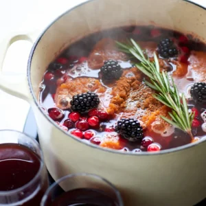 To make Poisoned Apple Cider, you need these key items: - 4 cups apple cider - 1 small pumpkin, peeled and cubed - 2 cups dark red cranberries (fresh or frozen) - 1 teaspoon cinnamon - 1 teaspoon nutmeg - 1 teaspoon allspice These ingredients work together to create a warm, cozy drink. The apple cider forms the base. The pumpkin adds creaminess. Cranberries give a tart taste. Spices like cinnamon and nutmeg add warmth. Allspice adds depth, making this drink special. You can use these optional items to enhance the flavor: - 1 tablespoon brown sugar (optional) - 1 tablespoon vanilla extract Adding brown sugar can sweeten the cider a bit. Vanilla extract adds a nice aroma. These ingredients can make your cider taste even better. Feel free to adjust them based on your taste. Presentation is key for this spooky drink! For a fun touch, use: - ½ cup blackberries for garnish - Sprigs of rosemary for garnish Blackberries add a pop of color. Rosemary looks like little witchy sprigs. These garnishes make your cider look festive and inviting. Serve in spooky mugs for an extra thrill! {{ingredient_image_1}} To start, gather your ingredients. You need: - 4 cups apple cider - 1 small pumpkin, peeled and cubed - 2 cups dark red cranberries (fresh or frozen) - 1 teaspoon cinnamon - 1 teaspoon nutmeg - 1 teaspoon allspice - 1 tablespoon brown sugar (optional) - 1 tablespoon vanilla extract In a large pot, combine the apple cider, cubed pumpkin, and cranberries. The pumpkin adds a nice texture. The cranberries bring a tart balance. Next, add the cinnamon, nutmeg, allspice, and brown sugar if you choose. Stir well to mix everything together. Now, heat the pot over medium heat. Watch closely until it starts to simmer. This usually takes about 5 to 10 minutes. Once it simmers, reduce the heat to low and cover the pot. Let it simmer for about 30 minutes. This step is key. It lets the flavors meld together beautifully. You’ll notice a lovely aroma filling your kitchen. After 30 minutes, you need to blend the mixture. Use an immersion blender to puree it until smooth. If you don’t have one, transfer it to a regular blender. Do this in small batches to avoid spills. Once blended, return the smooth mixture to the pot. Stir in the vanilla extract for an extra layer of flavor. Heat it for another 10 minutes to warm it through. Now your poisoned apple cider is ready to serve! To make the best poisoned apple cider, balance is key. The tartness of cranberries goes well with sweet apple cider. Use fresh or frozen cranberries. The pumpkin adds creaminess and a rich taste. Spices like cinnamon, nutmeg, and allspice bring warmth. If you want more sweetness, add brown sugar. This helps round out the flavors. Don’t forget the vanilla extract! It enhances the overall taste and aroma. Using the right equipment helps achieve the best cider. A large pot is essential for cooking the mixture. An immersion blender makes it easy to puree the cider smoothly. If you don’t have one, a regular blender works too. Just be careful when transferring hot liquid. Prepare heat-resistant mugs for serving. They keep your drink warm and look great too. Make your cider look as good as it tastes! Serve it in spooky mugs. For extra flair, add blackberries on top. They look like little dark gems. A sprig of rosemary adds a creepy touch. For a foggy effect, place dry ice in a separate container. This gives the cider a bubbling potion look. Your guests will love the spooky vibe! Pro Tips Choose Fresh Ingredients: Opt for fresh cranberries and seasonal pumpkins to enhance the flavor and quality of your cider. Adjust Sweetness: Taste the mixture before serving and adjust the sweetness by adding more brown sugar if desired, depending on your taste preference. Garnish Creatively: Use additional spooky garnishes like gummy worms or spooky-shaped ice cubes to make your presentation even more festive. Make Ahead: This cider can be made a day in advance. Just reheat gently before serving, allowing the flavors to deepen even more. {{image_2}} You can change the flavor of your poisoned apple cider by swapping or adding ingredients. Try using pear cider instead of apple cider for a different taste. You can also add a splash of orange juice for a zesty twist. Want some spice? Toss in a few cloves or a slice of fresh ginger. These simple swaps can make your drink unique and fun. You can enjoy poisoned apple cider in two ways. For a non-alcoholic drink, just follow the recipe as is. It’s perfect for kids and anyone who wants a tasty treat. If you want a kick, try adding rum or bourbon. Just mix in about a cup when you heat the cider. This gives it a warm, cozy feel for adults. You can make your cider special for any holiday. For Halloween, keep the spooky theme with creepy garnishes like gummy worms or spooky mugs. During Thanksgiving, focus on flavors like maple syrup or caramel. For Christmas, add some peppermint extract or even some cranberries on top for a festive look. These variations keep your poisoned apple cider fun and fresh all year round! Store your poisoned apple cider in a clean glass jar or airtight container. Make sure it cools to room temperature first. Label the container with the date. This helps you remember when you made it. Keep it in the fridge to stay fresh. Avoid metal containers as they can change the flavor. When stored properly, your poisoned apple cider can last up to five days in the fridge. After that, it may spoil. Always check for any off smells or changes in color. If it looks or smells bad, throw it out. Safety first! When reheating, do it on low heat. This helps keep the flavors intact. Stir often to avoid hot spots. Heat until it is warm but not boiling. If you have leftovers, never reheat more than once. Enjoy your spooky drink safely! If apple cider is poisoned, you may feel sick. Common symptoms include nausea, vomiting, and stomach pain. You might also have headaches or dizziness. In serious cases, you could feel confused or have trouble breathing. If you notice any of these signs after drinking cider, seek help fast. To check if apple cider is safe, start with your senses. Look for strange colors or floating bits. Smell it; if it smells off, do not drink it. Taste a small amount. If it tastes sour or strange, it might be bad. Always buy cider from a trusted source to stay safe. If you think the cider is poisoned, stop drinking it right away. Call poison control or seek medical help. Tell them what you drank and when. Keep the cider container for testing if needed. Do not wait for symptoms to appear; act quickly! Yes, there have been news stories about poisoned apple cider. Some cases involved people getting sick after drinking unregulated cider from local farms. These cases remind us to be careful when enjoying seasonal drinks. Always check where your cider comes from to ensure it is safe. In this blog post, we covered the core ingredients for a tasty apple cider. You learned step-by-step how to prepare and simmer it to boost flavor. We also discussed tips for the best taste and fun ways to serve it. Variations let you create seasonal drinks too. Lastly, we tackled storage tips and answered common questions about cider safety. Enjoy your delicious apple cider, and remember, safety first!