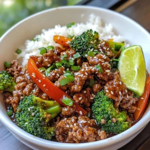 - 1 pound ground beef - 3 cups broccoli florets - 1 red bell pepper, sliced - ¼ cup soy sauce (low sodium) - 2 tablespoons sesame oil - 1 tablespoon honey - Sesame seeds - Chopped green onions - Lime wedges Ground beef and broccoli make a simple and tasty meal. You start with ground beef, which gives a hearty base. Next, add fresh broccoli florets. These add color and crunch to your dish. You can also throw in a sliced red bell pepper for sweetness. For flavor, use low-sodium soy sauce. This gives umami without too much salt. Add sesame oil for a nutty taste. A touch of honey adds a hint of sweetness. These seasonings work well together. If you want to dress up your dish, consider optional garnishes. Sesame seeds add a nice crunch. Chopped green onions bring freshness. A lime wedge adds a zesty kick when squeezed on top. Each ingredient plays a role in making this meal satisfying and full of flavor. {{ingredient_image_1}} - Mince the garlic. - Grate the ginger. - Slice the bell pepper. Start by prepping your ingredients. Mince three cloves of garlic. Use a grater for one inch of fresh ginger. Slice one red bell pepper into thin strips. This prep helps the dish cook evenly and adds great flavor. - Heat sesame oil in skillet. - Add garlic and ginger. Heat two tablespoons of sesame oil in a large skillet over medium-high heat. Once the oil is hot, add the minced garlic and grated ginger. Sauté for one to two minutes, until fragrant. This step builds a flavorful base for your dish. - Add ground beef to skillet. - Break apart and brown. Add one pound of ground beef to the skillet. Use a spatula to break it apart. Cook for about five to seven minutes until the beef is browned and cooked through. Drain any extra fat if needed. This keeps your dish lean and healthy. - Stir in broccoli and bell pepper. - Cook until broccoli is tender. Now, stir in three cups of broccoli florets and your sliced red bell pepper. Cook for four to five minutes. You want the broccoli to be tender but still bright green. This adds color and crunch to your meal. - Combine soy sauce, honey, and cornstarch slurry. - Pour over beef and veggies. In a bowl, mix together ¼ cup of low-sodium soy sauce, one tablespoon of honey, and a cornstarch slurry made from one tablespoon of cornstarch mixed with two tablespoons of water. Pour this mixture over the beef and vegetables. This sauce brings all the flavors together. - Thicken sauce and season. - Serve with rice or quinoa. Let the sauce cook for another two to three minutes until it thickens. Season with salt and pepper to taste. Serve your beef and broccoli hot over cooked rice or quinoa. This meal is simple yet packed with flavor. - Browning ground beef tips: Start with a hot skillet. Use medium-high heat for best results. Break the beef apart with a spatula. Cook until it is a rich brown color. This adds great flavor. - Cooking broccoli for optimal texture: Add broccoli when the beef is almost done. Cook it for just 4-5 minutes. You want it tender but still bright green. This keeps it crunchy and fresh. - Suggested spices to add: Try adding black pepper or crushed red pepper. A pinch of garlic powder also works well. These spices elevate the taste and give it a kick. - Using different sauces or marinades: Soy sauce is a classic, but you can mix things up. Try teriyaki or oyster sauce for a different vibe. Add honey for sweetness or chili sauce for heat. - Serving suggestions for visual appeal: Serve the dish in shallow bowls. This makes it look nice and inviting. A scoop of rice or quinoa underneath adds depth to the meal. - Garnishing tips for added flavor and color: Sprinkle sesame seeds on top for crunch. Chopped green onions add a pop of color. A lime wedge on the side gives a fresh zest. Pro Tips Use Fresh Ingredients: Fresh broccoli and vibrant bell peppers enhance the flavor and texture of the dish. Look for firm, bright-colored vegetables for the best results. Adjust the Spice Level: If you enjoy a bit of heat, consider adding red pepper flakes or a dash of sriracha to the sauce for an extra kick. Make it a Meal Prep Favorite: This dish stores well in the fridge for up to 3 days. Prepare it in advance for quick lunches or dinners throughout the week. Experiment with Proteins: Feel free to substitute ground beef with ground turkey, chicken, or a plant-based alternative for a different flavor profile while keeping it healthy. {{image_2}} You can change the meat in this dish. Try using turkey or chicken instead of ground beef. These options make the meal lighter. You can also add other veggies. Carrots or snap peas work well. They add sweetness and crunch to the dish. If you need gluten-free options, use tamari sauce instead of soy sauce. This keeps the flavor while avoiding gluten. For those on a low-carb diet, consider using cauliflower rice instead of regular rice. It adds fiber and cuts carbs while still tasting great. Want to spice things up? Add chili flakes to the cooking beef. This gives your dish a nice kick. If you enjoy sweet and sour flavors, mix in a bit more honey or a splash of vinegar. This balance enhances the overall taste and makes the meal unique. To keep your leftovers fresh, store them in an airtight container. This method helps keep your dish tasty and safe. In the fridge, your ground beef and broccoli will last for about three to four days. Always label your container with the date to stay organized. For the best taste, reheat your meal on the stove. Just add a splash of water or broth to prevent sticking. Heat it over medium heat, stirring often, until warm. If you use a microwave, cover the bowl with a microwave-safe lid or wrap. Heat in short bursts, checking often to avoid overcooking. If you want to freeze your dish, let it cool completely. Then, portion it into freezer-safe bags or containers. Squeeze out any air to prevent freezer burn. For the best flavor, use it within three months. When ready to eat, thaw it in the fridge overnight before reheating. You can serve ground beef and broccoli with a few tasty sides. Here are some great options: - Steamed rice - Quinoa - Cauliflower rice - Noodles - Side salad These sides add balance and extra flavors to the meal. A fresh salad brings a nice crunch and brightens the plate. Yes, you can make this recipe ahead of time. Here are some steps for meal prepping: 1. Cook the ground beef and vegetables as directed. 2. Let the dish cool completely. 3. Place it in an airtight container. 4. Store in the fridge for up to three days. When you’re ready to eat, reheat it on the stove or in the microwave. This makes busy days easier. Ground beef and broccoli can be a healthy choice. Here’s a quick look at its nutrition: - Ground beef provides protein and iron. - Broccoli is rich in vitamins C and K. - The dish is low in carbs if served without rice. This meal offers balanced nutrients and can fuel your body well. Yes, you can use frozen broccoli. Just keep these adjustments in mind: - Thaw the broccoli before cooking. - Cook it for a shorter time, about 2-3 minutes. Frozen broccoli can save time and still taste great. Just make sure it’s tender but still bright green. This blog post covered a tasty recipe for ground beef and broccoli. You learned about key ingredients, like fresh veggies and savory sauces. I shared step-by-step instructions to make cooking easy. Plus, I provided tips to make it even better and variations to try. Cooking can be fun and rewarding. With these ideas, you can enjoy a great meal. Try mixing things up and making it your own! Your kitchen adventures are just beginning.
