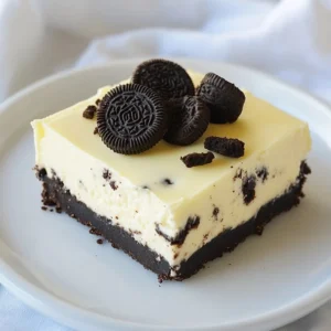 To make No-Bake Oreo Cheesecake Bars, you need the right ingredients. Here is the detailed list: - 24 Oreo cookies (crushed) - 6 tablespoons unsalted butter (melted) - 2 cups cream cheese (softened) - 1 cup powdered sugar - 1 teaspoon vanilla extract - 1 cup heavy whipping cream - 12 Oreo cookies (chopped) - Optional garnishes: extra Oreo cookies These ingredients bring rich flavors together. The crushed Oreos form a tasty crust that holds the filling nicely. The cream cheese adds a smooth texture. Powdered sugar gives it sweetness, while vanilla adds depth. Heavy cream helps to make it light and fluffy. Chopped Oreos mixed in give a nice crunch. Make sure to use good-quality cream cheese. It makes a big difference in taste. If you want a fun twist, you can add extra Oreos as a garnish on top. This dessert is simple yet so satisfying. Happy baking! {{ingredient_image_1}} To start, take 24 Oreo cookies and crush them. You can use a food processor or place them in a bag and hit them with a rolling pin. Next, melt 6 tablespoons of unsalted butter in a microwave or on the stove. Mix the crushed Oreos and melted butter in a bowl. Stir until the mixture looks like wet sand. Now, take an 8x8 inch baking dish and line it with parchment paper. This makes it easier to remove the bars later. Press the Oreo mixture firmly into the bottom of the dish. Make sure it is even and compact. Place the dish in the fridge while you prepare the filling. In a large bowl, beat 2 cups of softened cream cheese using an electric mixer. Mix until it is smooth and creamy. Next, add 1 cup of powdered sugar and 1 teaspoon of vanilla extract. Keep mixing until everything is well blended and there are no lumps left. In a separate bowl, pour in 1 cup of heavy whipping cream. Whip the cream until stiff peaks form. This usually takes a few minutes. Once whipped, carefully fold the whipped cream into the cream cheese mixture. Mix gently to keep the whipped cream fluffy. Now, take 12 chopped Oreo cookies and gently fold them into the cheesecake batter. This adds extra flavor and texture. Remove the crust from the fridge. Pour the cheesecake filling over the crust. Use a spatula to spread it evenly. Cover the dish with plastic wrap and place it back in the fridge. Chill for at least 4 hours, or until it is fully set. Once set, you can cut the bars into squares. If you like, garnish with extra Oreo cookies on top for a fun touch. Enjoy your delicious No-Bake Oreo Cheesecake Bars! To make your cheesecake smooth, always use softened cream cheese. Cold cream cheese can lead to lumps. Leave it out for about an hour before you start mixing. This step really helps. Whipping the cream properly is key too. Use a clean bowl and beaters. Start on low and then increase the speed. Whip until you see stiff peaks. This means the cream holds its shape well. Be gentle when folding it into the cream cheese. Overmixing can make it runny. To cut clean bars, use a sharp knife. Dip the knife in hot water, then wipe it dry. This helps the knife glide through the bars smoothly. Decorate your bars with extra Oreos on top. You can crush them or leave them whole. For a fun touch, drizzle some chocolate sauce over the bars. It looks nice and adds flavor. One common mistake is overmixing the cream cheese. This can make your cheesecake too soft. Mix just until smooth and fluffy. Another mistake is not chilling long enough. The bars need at least four hours in the fridge. This step helps them set properly. If you cut them too soon, they may fall apart. Pro Tips Use Room Temperature Cream Cheese: Make sure your cream cheese is at room temperature before mixing. This will ensure a smooth and creamy texture in your cheesecake filling. Chill the Bars Overnight: For the best results, allow the cheesecake bars to chill overnight. This extra time helps the flavors meld and the texture to set perfectly. Customize with Toppings: Feel free to get creative with toppings! You can add chocolate drizzle, whipped cream, or even crushed nuts for an extra crunch. Use a Sharp Knife for Slicing: When it's time to cut the bars, make sure to use a sharp knife. Wipe the knife with a damp cloth between cuts for clean slices. {{image_2}} You can change the flavor of your cheesecake bars easily. Try using different cookies. For example, chocolate chip cookies add a nice twist. You can also mix in extracts. Almond or mint extracts can give a fresh taste. Just a little can change the whole dessert. If you need gluten-free options, use gluten-free Oreo cookies. They taste great and work well in the recipe. For vegan alternatives, swap cream cheese for a plant-based version. Use coconut cream instead of heavy cream for a light texture. These options keep the treat tasty while meeting dietary needs. Seasonal toppings can make your bars even more fun. In summer, add fresh strawberries for a bright touch. During the holidays, consider a festive look. Use crushed candy canes or colorful sprinkles. These ideas make your dessert stand out for any occasion. To keep your No-Bake Oreo Cheesecake Bars fresh, first cover them. Use plastic wrap or foil to prevent air from getting in. The best way to store these bars is in the fridge. Place them in an airtight container. This helps keep them moist and tasty. You can freeze these bars for long-term storage. Cut them into individual pieces before freezing. Wrap each piece in plastic wrap. Then place them in a freezer bag. This keeps them safe from freezer burn. To thaw, move a bar to the fridge for a few hours. You can also leave it at room temperature for about 30 minutes before eating. In the fridge, your bars can stay fresh for about five days. Always check for signs of spoilage. If you see any changes in color or smell, do not eat them. If the bars become too soft or watery, it’s best to throw them away. Keeping them stored correctly will help you enjoy this treat longer! No-Bake Oreo Cheesecake Bars can last up to five days in the fridge. Make sure to store them in an airtight container. This helps keep them fresh and tasty. After five days, they may lose some flavor and texture. Yes, you can make these bars ahead of time. They are great for parties or gatherings. Make them one day before, and let them chill overnight. This lets the flavors blend and makes them even better. If you need a cream cheese substitute, try using Greek yogurt. It gives a similar texture but with a tangy taste. You can also use vegan cream cheese for a dairy-free option. Just ensure it blends well with the other ingredients. To cut the bars neatly, use a sharp knife. First, run the knife under hot water to warm it up. Wipe it dry, then slice the bars. This helps create clean edges. For best results, cut them while they are cold from the fridge. Absolutely! You can swap Oreos for other cookies like chocolate chip or peanut butter cookies. Each type will change the flavor. Use your favorite cookies to create a new twist on this classic treat. Just remember to adjust the amount of butter if needed. You now have a complete guide to making No-Bake Oreo Cheesecake Bars. We covered each step, from the ingredients to preparation and storage. Remember to use softened cream cheese for the best texture. Don't rush the chilling process; it’s key for the perfect set. Feel free to experiment with flavors and toppings. These bars are fun to make and adapt. Enjoy sharing them with friends and family. Happy baking!