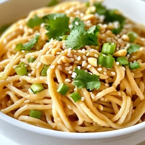 For Minute Sesame Peanut Noodles, start with your favorite noodles. You can use: - 200g soba noodles - 200g rice noodles - 200g egg noodles - 200g whole wheat noodles Each type gives a unique taste and texture. Soba noodles add a nutty flavor, while rice noodles offer a light touch. Choose what you like best! Next, let’s make the sauce. Gather these key ingredients: - 3 tablespoons creamy peanut butter - 2 tablespoons soy sauce (or tamari for gluten-free) - 1 tablespoon sesame oil - 1 tablespoon honey or maple syrup - 1 tablespoon rice vinegar - 2 cloves garlic, minced - ½ teaspoon grated fresh ginger These ingredients create a rich and creamy sauce. The peanut butter adds depth, while soy sauce gives a savory taste. Honey or maple syrup brings sweetness. Rice vinegar adds a tangy kick. Finally, let's talk about garnishes. They add color and flavor. Use these for a tasty finish: - 2 green onions, chopped - ¼ cup crushed peanuts (for garnish) - Sesame seeds (for garnish) - Fresh cilantro (optional, for garnish) Green onions add freshness, while crushed peanuts give crunch. Sesame seeds sprinkle on top for a nutty flavor. Fresh cilantro is a great way to bring in some herbal notes. You can mix and match these to your liking! {{ingredient_image_1}} Start by boiling water in a large pot. Once the water is bubbling, add 200 grams of your favorite noodles. You can use soba or rice noodles. Cook them as per the package instructions until they are al dente. This usually takes about 5 to 7 minutes. After cooking, drain the noodles and rinse them under cold water. This helps stop the cooking. Set the noodles aside while you make the sauce. In a medium bowl, gather your sauce ingredients. You will need 3 tablespoons of creamy peanut butter, 2 tablespoons of soy sauce, and 1 tablespoon of sesame oil. Add 1 tablespoon of honey or maple syrup for sweetness. Then, mix in 1 tablespoon of rice vinegar, 2 cloves of minced garlic, and ½ teaspoon of grated fresh ginger. Now, whisk these together until you have a smooth and creamy sauce. This is where the flavor comes from. In a large mixing bowl, add your drained noodles. Pour the peanut sauce over them. Toss the noodles gently until they are well coated with the sauce. This step is key, as you want every noodle to taste great. Once mixed, divide the noodles into serving bowls. Top them with chopped green onions, crushed peanuts, and sesame seeds. If you like, add fresh cilantro for extra flavor. For a final touch, drizzle a little extra sesame oil on top. Enjoy your tasty meal! To make great Minute Sesame Peanut Noodles, start with the right noodles. I love using soba or rice noodles. They cook quickly and taste amazing. Always follow the package directions for cooking time. This helps you get that perfect, tender bite. After cooking, drain the noodles well. Rinse them under cold water to stop cooking. This step keeps the noodles from sticking together. You can change the flavor of your noodles easily. Try adding different sauces or spices. For a tangy twist, add lime juice or chili paste. If you want a bit of crunch, toss in some fresh veggies. Try bell peppers, carrots, or cucumbers for texture. Want a richer taste? A splash of coconut milk can make it creamy. These simple changes keep your meal fun and exciting. Making these noodles vegan is easy. Just swap honey for maple syrup. For a gluten-free version, use tamari instead of soy sauce. You can also use gluten-free noodles. This way, everyone can enjoy them. Always check labels to ensure all ingredients fit your diet. With these swaps, deliciousness stays the same while meeting your needs. Pro Tips Choose the Right Noodles: For a more authentic flavor, use soba noodles; for a gluten-free option, stick with rice noodles. Adjust the Sauce: Customize the sauce to your taste by adding more soy sauce for saltiness or more honey/maple syrup for sweetness. Prep Ahead: You can prepare the sauce in advance and store it in the fridge for up to a week, making meal prep a breeze. Garnish Creatively: Feel free to experiment with garnishes like shredded carrots, bell peppers, or even a squeeze of lime for added zest. {{image_2}} You can easily boost your Minute Sesame Peanut Noodles with protein. Tofu is a great choice. It absorbs the sauce well and adds texture. Simply cube firm tofu and sauté it until golden brown. Chicken is another option. Cook it in a pan, then slice it thin. Shrimp cooks fast and adds a lovely flavor. Just toss them in for a couple of minutes until pink. Adding veggies makes your dish colorful and healthy. Bell peppers add crunch and sweetness. Slice them into thin strips and toss them in with the cooked noodles. Broccoli is another fantastic option. Steam or blanch it until bright green, then mix it in. You can also use carrots, snap peas, or spinach. Feel free to get creative with your favorites! If you love heat, add some spice to your noodles. Chili oil gives a great kick. Drizzle it over the noodles right before serving. Red pepper flakes are another easy way to add heat. Just sprinkle a little on top to taste. You can start with a small amount and add more if you like it spicy. Enjoy customizing your dish! To store your Minute Sesame Peanut Noodles, first let them cool. Place the noodles in an airtight container. This keeps the noodles fresh and tasty. They will stay good in the fridge for up to three days. If you want to keep them longer, freeze the noodles. They can last for about one month in the freezer. When you're ready to eat your leftovers, reheating is easy. If frozen, thaw the noodles overnight in the fridge. For quick reheating, place the noodles in a microwave-safe bowl. Add a splash of water to help them steam. Heat on high for one to two minutes. Stir halfway to make sure they heat evenly. You can also reheat them on the stove. Just add a little oil and toss them in a pan over medium heat for about five minutes. Meal prep can make your week easier. Cook a big batch of noodles at the start of the week. Store the sauce separately to keep it fresh. When you are ready to eat, just mix the noodles and sauce. You can also add fresh veggies or protein then. This saves time and makes for a quick meal anytime. Yes, you can! You have many options for noodles. Soba noodles work well. Rice noodles are a great gluten-free choice. You can also try whole wheat noodles. Just cook them according to package directions. If you need a substitute, try almond butter. Cashew butter is another tasty option. Sunflower seed butter works too, especially for nut-free diets. Each will change the flavor a bit, but they all taste great! These noodles can last up to four days in the fridge. Just keep them in an airtight container. If you notice the sauce thickening, add a splash of water or soy sauce when you reheat them. Enjoy your delicious leftovers! This guide covered key ingredients and clear steps to make tasty sesame peanut noodles. You learned about essential noodles, sauces, and tasty garnishes. I shared tips for perfect cooking and options for varied flavors. You can add protein and veggies for extra nutrition. Remember to store leftovers properly for later meals. Overall, this dish is easy and fun to make. Enjoy your noodles, and don't be afraid to get creative!