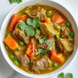 - 2 lbs lamb shoulder, cut into bite-sized pieces - 2 tablespoons vegetable oil - 1 large onion, finely chopped - 4 garlic cloves, minced - 1 tablespoon fresh ginger, grated Lamb shoulder is the star of this dish. It becomes tender and full of flavor as it cooks. I use vegetable oil to sear the lamb. This step gives it a nice brown color. Onions, garlic, and ginger add a great depth of taste. They create a base that makes your curry rich and aromatic. - 2 tablespoons curry powder - 1 tablespoon ground cumin - 1 teaspoon ground coriander - 1 teaspoon turmeric - Salt and pepper Spices are key to a great curry. I love using curry powder, cumin, coriander, and turmeric. They blend well together and give the dish its warm color and taste. Salt and pepper enhance all these flavors. - 1 can (14 oz) coconut milk - 1 cup vegetable broth - 1 can (14 oz) diced tomatoes - 2 medium carrots, sliced - 1 red bell pepper, diced - 1 cup frozen peas - Fresh cilantro, chopped for garnish Coconut milk makes the curry creamy and dreamy. Vegetable broth adds more flavor. Diced tomatoes give a nice tang. Carrots and red bell peppers add crunch and color. Frozen peas are added for sweetness. Finally, fresh cilantro is perfect for garnish, adding brightness to your dish. {{ingredient_image_1}} To start, I heat 2 tablespoons of vegetable oil in a large skillet. I use medium-high heat for this. Then, I add 2 pounds of lamb shoulder, cut into bite-sized pieces. I sear the lamb until it is browned on all sides. This step adds great flavor. Once browned, I remove the lamb from the skillet and set it aside. Next, I keep the same skillet for the next step. I add 1 large finely chopped onion, 4 minced garlic cloves, and 1 tablespoon of grated fresh ginger. I sauté these until the onion is soft and translucent, which takes about 5 minutes. After that, I stir in 2 tablespoons of curry powder, 1 tablespoon of ground cumin, 1 teaspoon of ground coriander, and 1 teaspoon of turmeric. I let the spices cook for another 1-2 minutes until they smell great. Now, I transfer the sautéed onion and spice mix to the slow cooker. I add the seared lamb back in. Next, I pour in 1 can of coconut milk, 1 cup of vegetable broth, and 1 can of diced tomatoes. I stir everything together well. Then, I add 2 medium sliced carrots and 1 diced red bell pepper. I season the mix with salt and pepper to taste. I cover the slow cooker and set it to cook. I can choose to cook on low for 8 hours or high for 4 hours. I prefer low heat for tender lamb. In the last 30 minutes of cooking, I stir in 1 cup of frozen peas. This adds color and sweetness. Before serving, I garnish the curry with fresh chopped cilantro. For the best slow cooker lamb curry, I recommend using lamb shoulder. This cut has great flavor and tenderness when cooked slowly. It breaks down well, making it perfect for a curry. Lamb leg is another option, but it can be a bit leaner. When considering price, lamb shoulder is often more affordable than leg. Check local markets and sales for the best deals. Sometimes, buying in bulk can save money too. To make your curry even tastier, adjust the seasoning based on your taste. You can add more salt or pepper if needed. I love using fresh herbs, like cilantro, to brighten the dish. For spices, try mixing curry powder with garam masala for an extra kick. You can also add a pinch of cinnamon for warmth. Don’t forget to taste as you go. This helps you find the perfect balance. Serve your slow cooker lamb curry over fluffy basmati rice. The rice soaks up the sauce and adds a nice texture. You can also use naan bread to scoop up the curry. For a beautiful presentation, garnish with fresh cilantro and a sprinkle of chili flakes. This adds color and a hint of heat. It makes your dish look as good as it tastes! Pro Tips Marinate the Lamb: For deeper flavor, marinate the lamb in yogurt and spices for a few hours or overnight before cooking. Layer the Flavors: Searing the meat and sautéing the aromatics first helps build a richer, more complex flavor in the curry. Customize the Vegetables: Feel free to add or substitute vegetables like potatoes or green beans based on your preference or what you have on hand. Serve with Accompaniments: Pair the curry with naan bread or a side of yogurt to balance the spices and enhance the meal. {{image_2}} You can switch up the protein in this curry. If you want to use beef or chicken, they work well with the same spices. Beef adds a rich flavor, while chicken offers a lighter taste. For a vegetarian twist, you can try chickpeas or lentils. They will soak up the curry flavors nicely. Do you like your curry mild or spicy? If you want a mild lamb curry, use less curry powder and skip hot peppers. For a spicy kick, add chili flakes or fresh chilies. You can also add a bit of cayenne pepper for extra heat. Adjust to your taste for the perfect balance. Curry has many regional styles. Indian curries often use yogurt and fresh herbs, while Thai curries may include lime leaves and basil. You can even make fusion dishes by adding ingredients like peanut butter for a Thai twist. Explore different spices to create your own unique flavor profile. After enjoying your meal, let the leftovers cool. Place them in airtight containers. This keeps them fresh and safe. Glass or plastic containers work well. Label them with the date so you remember when you stored them. To freeze your curry, let it cool completely. Transfer it to freezer-safe containers. Leave some space at the top, as it will expand. You can also use freezer bags. When ready to eat, thaw it in the fridge overnight. Reheat it on the stove until hot. For best taste, add a splash of coconut milk while reheating. In the fridge, your lamb curry lasts about 3 to 4 days. If frozen, it can last up to 3 months. Always check for signs of spoilage before eating. If you see any strange colors or smell anything off, toss it away. Safe food means tasty food! You can skip searing the lamb, but it has pros and cons. Searing gives the meat a rich, deep flavor and nice color. It also adds texture. If you skip it, your curry may be less rich but still tasty. For busy days, just add the raw lamb straight to the slow cooker. You can serve lamb curry with rice or bread. Basmati rice is a classic choice. Naan or roti adds a nice touch too. For a fresh side, try a simple salad. You can also serve yogurt or chutney for added flavor. These pairings balance the curry's richness and spice. Cook the lamb on low for 8 hours or on high for 4 hours. The lamb should be tender and fall apart easily. If you're short on time, use the high setting. Just be sure to check the lamb's doneness. Yes, you can use frozen vegetables in your curry. They save time and add nutrition. Just add them in the last 30 minutes of cooking. This keeps them bright and slightly crisp. Make sure to adjust the seasoning, as frozen veggies can be less flavorful. This blog post covers the essentials for making slow cooker lamb curry. You learned about the key ingredients, spices, and step-by-step instructions to create a flavorful dish. I shared tips for selecting the right lamb and adjusting flavors. You also found different variations to suit your taste and storage tips for leftovers. Slow cooker lamb curry is a delicious, versatile meal. It’s easy to make and perfect for sharing. With a few simple steps, you can enjoy this hearty dish anytime.