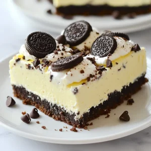 - 24 Oreo cookies (plus 2 for topping), crushed - ¼ cup unsalted butter, melted - 2 cups cream cheese, softened - 1 cup powdered sugar - 1 teaspoon vanilla extract - 1 cup heavy whipping cream - ½ cup mini chocolate chips When choosing Oreo cookies, go for the classic ones. They give the best flavor. For cream cheese, full-fat options work best. They create a rich, creamy texture. Use high-quality vanilla extract for a deeper flavor. Always pick fresh heavy cream for the best whipped topping. This makes your cheesecake bars light and fluffy. You can swap Oreo cookies with any chocolate cookies you like. This change will still give you a great crust. If you want a lighter option, use low-fat cream cheese. You can also use coconut cream instead of heavy cream for a dairy-free version. Lastly, if you don’t have mini chocolate chips, regular ones work too. {{ingredient_image_1}} To start, grab a medium bowl. Add 24 crushed Oreo cookies and ¼ cup of melted butter. Mix them well until the crumbs look moist. This ensures the base sticks together. Next, take a 9x9 inch baking dish and press the mixture firmly into the bottom. I like using the back of a measuring cup for this. Aim for an even layer. Once done, set it aside to prepare the filling. Now, let’s make the creamy filling. In a large mixing bowl, beat 2 cups of softened cream cheese. Use an electric mixer to get it smooth and creamy. Next, add in 1 cup of powdered sugar and 1 teaspoon of vanilla extract. Mix until it’s well blended. In a separate bowl, whip 1 cup of heavy whipping cream until it forms stiff peaks. This adds lightness to your cheesecake. Gently fold the whipped cream into the cream cheese mixture. For extra fun, fold in ½ cup of mini chocolate chips. Pour the cheesecake filling over your Oreo crust. Use a spatula to spread it out evenly. Once that’s done, cover the dish and put it in the fridge. Let it chill for at least 4 hours. This helps it set properly. Before serving, crumble 2 Oreo cookies on top for a nice finish. Slice into squares and enjoy your delicious no-bake Oreo cheesecake bars! To get the best texture in your no-bake Oreo cheesecake bars, use softened cream cheese. It helps mix well and gives a smooth filling. Whip your heavy cream until stiff peaks form. This step adds volume and lightness to your cheesecake. When mixing, fold gently to keep that airy feel. Adding mini chocolate chips adds crunch and makes each bite fun. One common mistake is using cold cream cheese. Always soften it first for a creamy mix. If you skip whipping the cream enough, your bars may turn out dense. Make sure to press the crust firmly in the pan. A loose crust can crumble when you cut the bars. Also, don't rush the chilling time. They need at least four hours to set properly. Serving these cheesecake bars is easy and fun. Slice them into squares for a neat look. Top with crumbled Oreos for a nice touch. You can also add a drizzle of chocolate syrup for extra flair. For a party, arrange them on a colorful plate. Add fresh berries for contrast. This adds color and freshness to your dessert table. Pro Tips Use Room Temperature Cream Cheese: Ensure your cream cheese is at room temperature for a smoother filling without lumps. Chill the Bars Long Enough: Allowing the cheesecake bars to chill for at least 4 hours ensures they are set and easier to slice. Experiment with Toppings: Feel free to add different toppings like whipped cream or caramel drizzle for a unique twist. Store Properly: Keep any leftovers in an airtight container in the refrigerator to maintain freshness for up to 5 days. {{image_2}} You can change the flavor of these Oreo cheesecake bars easily. Try using different cookies. For example, use peanut butter or mint Oreos for a fun twist. You can also mix in flavors like lemon or raspberry into the cream cheese mixture. Just add some zest or fruit puree when you mix in the powdered sugar. This gives a fresh taste that pairs well with the creamy filling. Toppings can make your cheesecake bars even better. Instead of just crumbled Oreos, try adding fresh fruit on top. Strawberries or blueberries add color and flavor. You can also drizzle chocolate or caramel sauce over the bars. For a crunchy touch, sprinkle some chopped nuts or crushed candy bars. These toppings not only taste great, but they also make your dessert more fun to look at. These cheesecake bars shine at parties or family gatherings. Serve them on a nice platter with colorful fruit around them. For a birthday, add candles or colorful sprinkles on top. If you’re hosting a holiday, consider adding seasonal decorations or themed toppings. A simple dessert can become a star of the table with just a few changes. Remember, presentation matters as much as taste! Store your No Bake Oreo Cheesecake Bars in an airtight container. This keeps them fresh and tasty. Make sure to place a layer of plastic wrap over the bars before sealing. This adds extra protection. Refrigerate them right after they set. The cool temperature helps maintain their creamy texture. You can freeze these cheesecake bars for later. First, cut them into squares. Wrap each square tightly in plastic wrap. Place the wrapped pieces in a freezer-safe bag. Be sure to label the bag with the date. This way, you’ll know how long they’ve been in the freezer. In the fridge, these bars last about 5 days. If you freeze them, they can last up to 2 months. Just remember to thaw them in the fridge overnight before you eat them. Enjoy every bite of your delicious treats! Yes, you can make these bars a day or two ahead. They taste even better after chilling overnight. Just keep them covered in the fridge. This helps the flavors mix well. You can serve them straight from the fridge. You can tell the cheesecake is set when it feels firm. Press gently on the surface with your finger. If it springs back, it's ready. Chill them for at least four hours to ensure they firm up. If you have time, letting them chill longer is even better. You can use regular cream cheese if you prefer. It will make the bars richer and creamier. Just ensure it is softened for easy mixing. You will still get that great Oreo flavor with the regular cream cheese. This blog post covered how to make delicious cheesecake bars using Oreos. We discussed key ingredients, including quality choices and substitutes. You learned the steps for the base, the filling, and how to chill them right. I shared tips for texture, common errors, and serving ideas. You also explored flavor variations and storage practices. Making these bars is simple and fun. Remember, the right ingredients and preparation make all the difference. Enjoy experimenting with flavors and impressing your friends!